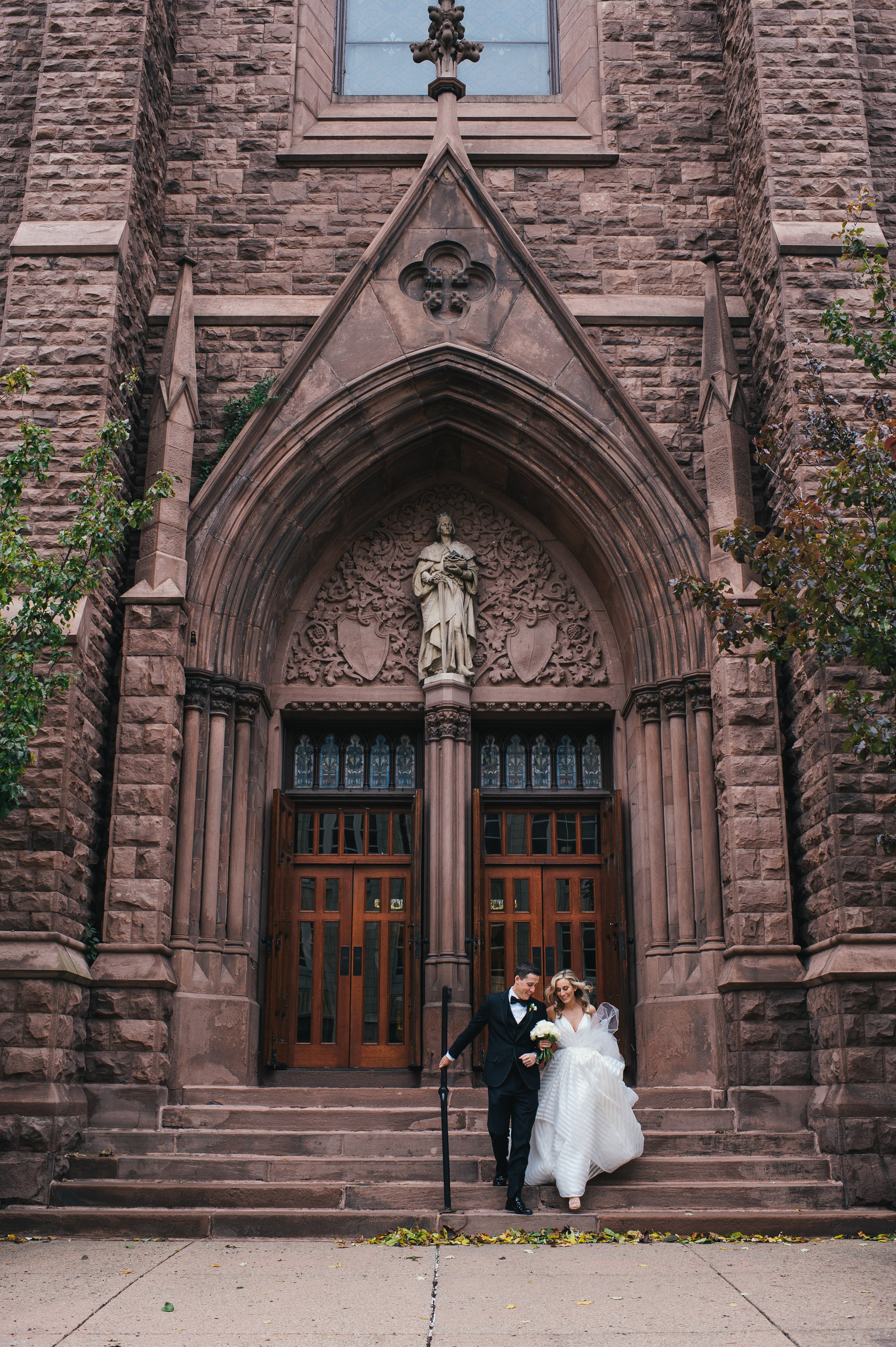 Bride and groom at their wedding ceremony for black, white, and gold wedding in Buffalo, NY planned by Exhale Events. Find more wedding inspiration at exhale-events.com!