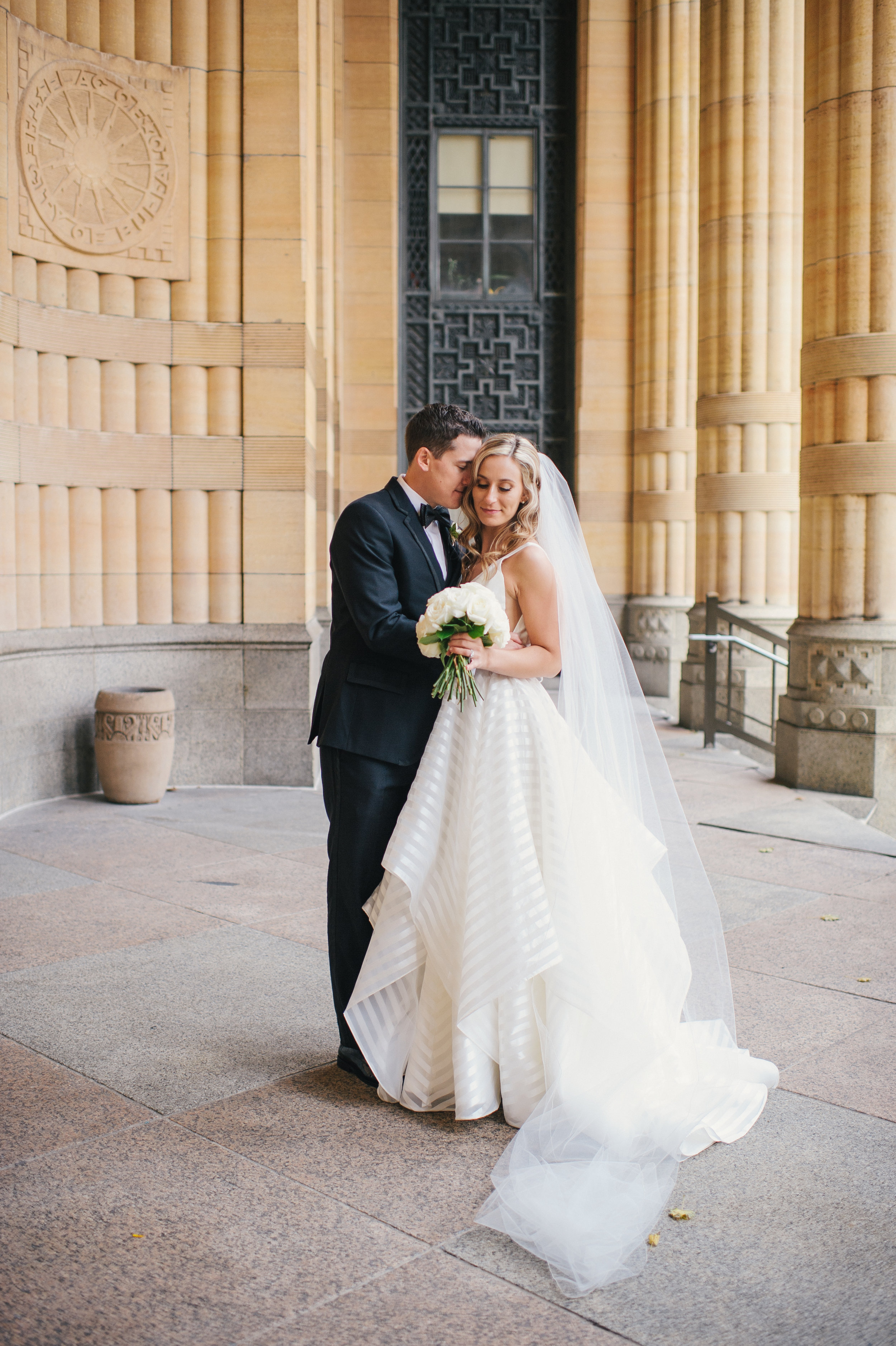 Bride and groom pose for outdoor wedding photos for black, white, and gold wedding in Buffalo, NY planned by Exhale Events. Find more wedding inspiration at exhale-events.com!
