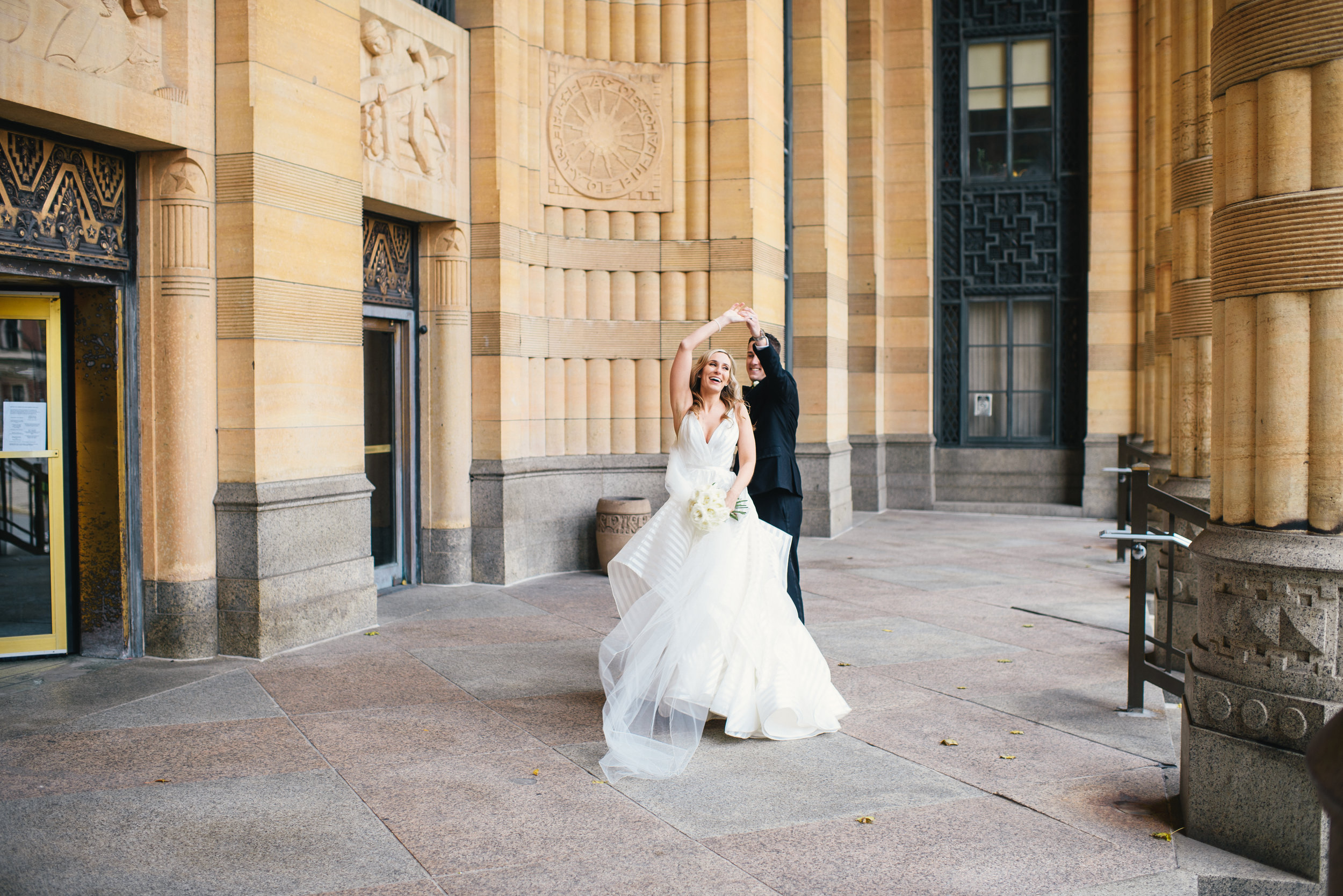 Bride and groom pose for outdoor wedding photos for black, white, and gold wedding in Buffalo, NY planned by Exhale Events. Find more wedding inspiration at exhale-events.com!
