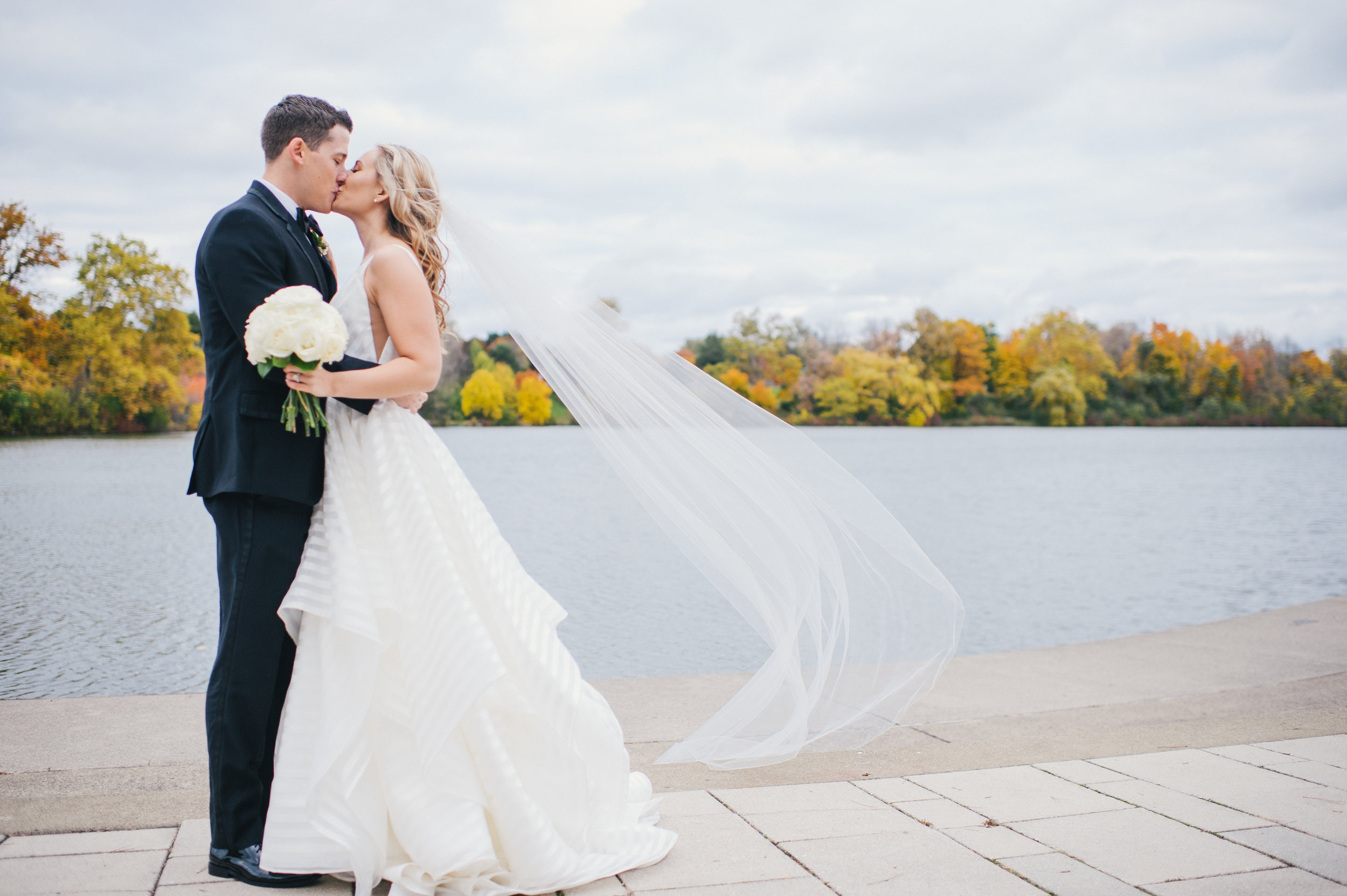 Bride and groom pose for outdoor wedding photos for black, white, and gold wedding in Buffalo, NY planned by Exhale Events. Find more wedding inspiration at exhale-events.com!