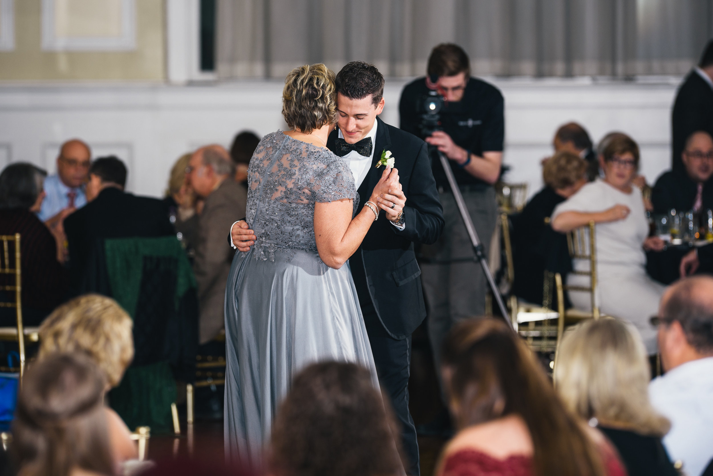 Groom and his mother share mother/son dance at black, white, and gold wedding in Buffalo, NY planned by Exhale Events. Find more wedding inspiration at exhale-events.com!