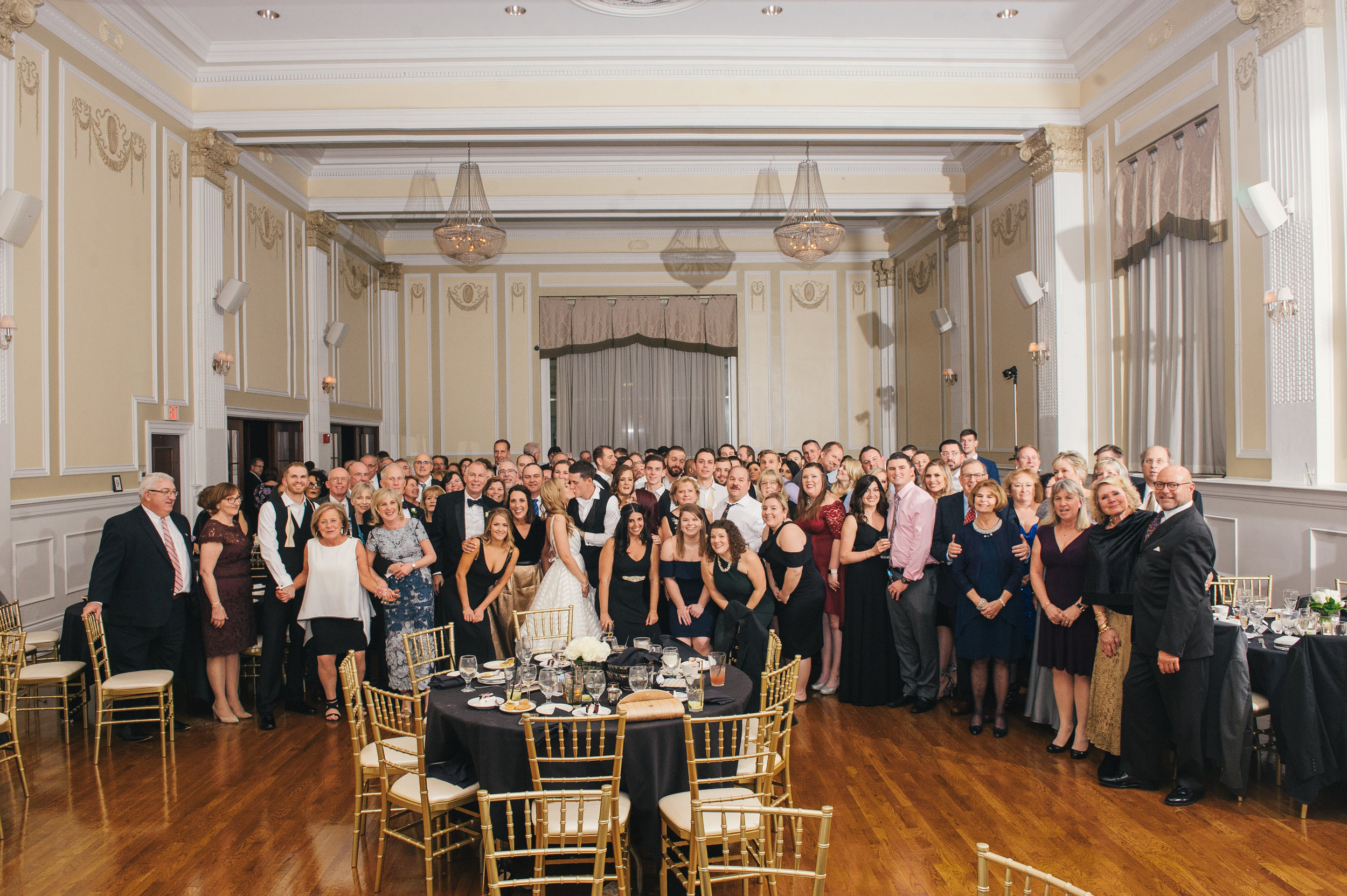Group wedding photo with wedding guests at black, white, and gold wedding in Buffalo, NY planned by Exhale Events. Find more wedding inspiration at exhale-events.com!