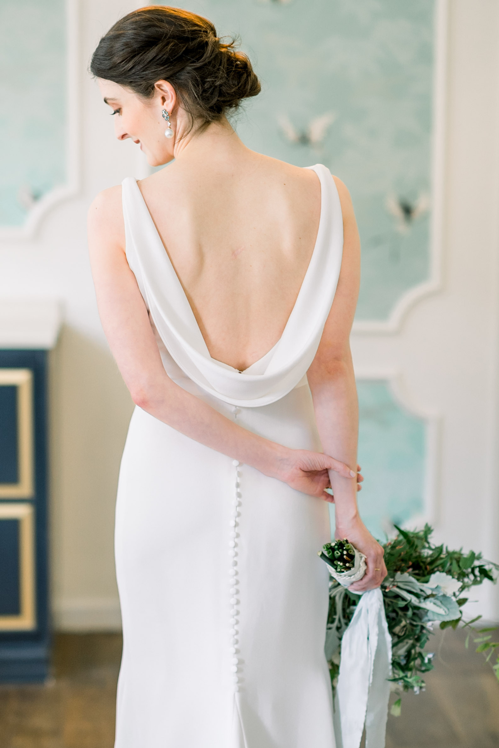 Brides posing for portrait in wedding dress for Pittsburgh wedding at Hotel Monaco planned by Exhale Events. Find more modern wedding ideas at exhale-events.com!