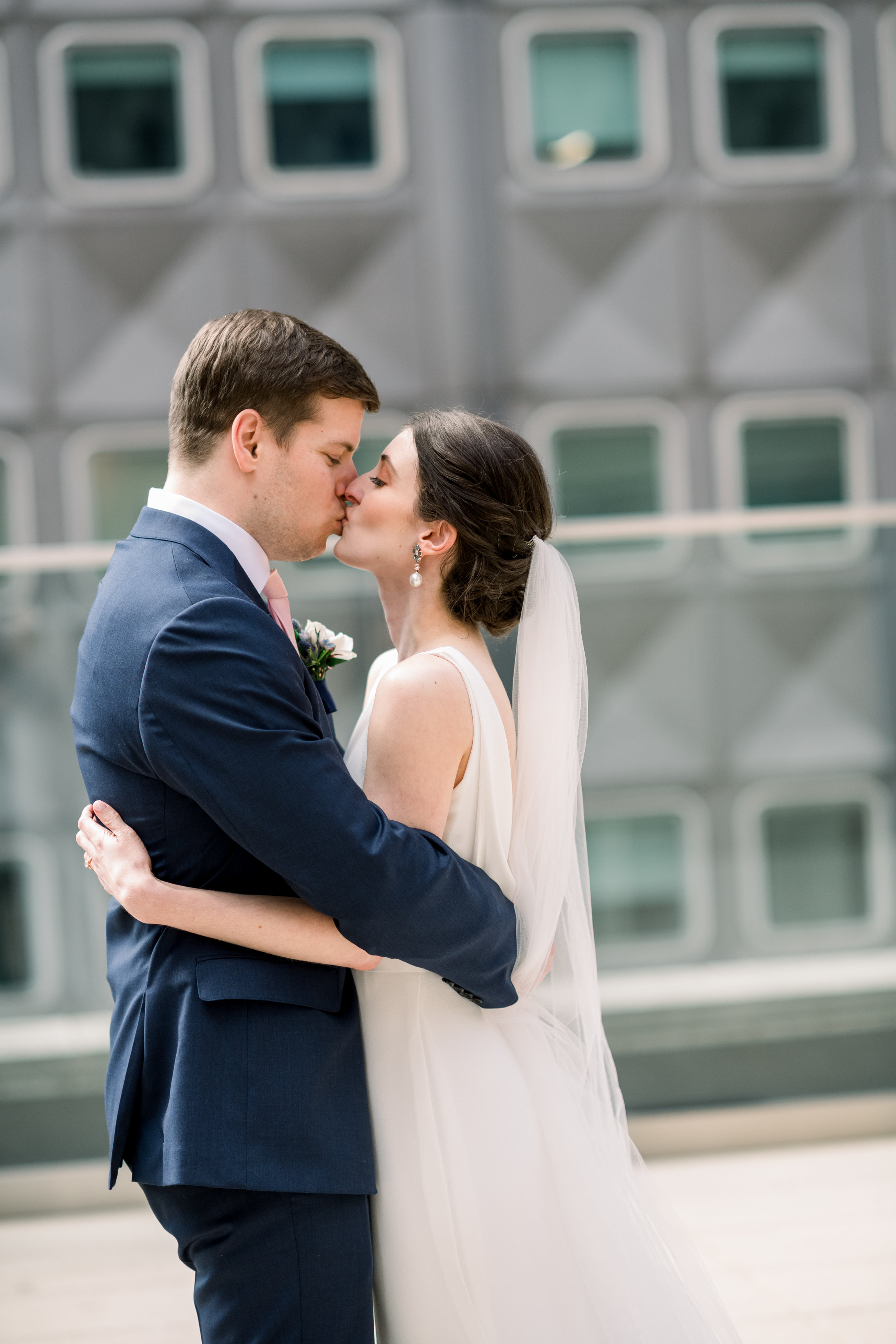 Bride and groom share first look for Pittsburgh wedding at Hotel Monaco planned by Exhale Events. Find more modern wedding ideas at exhale-events.com!