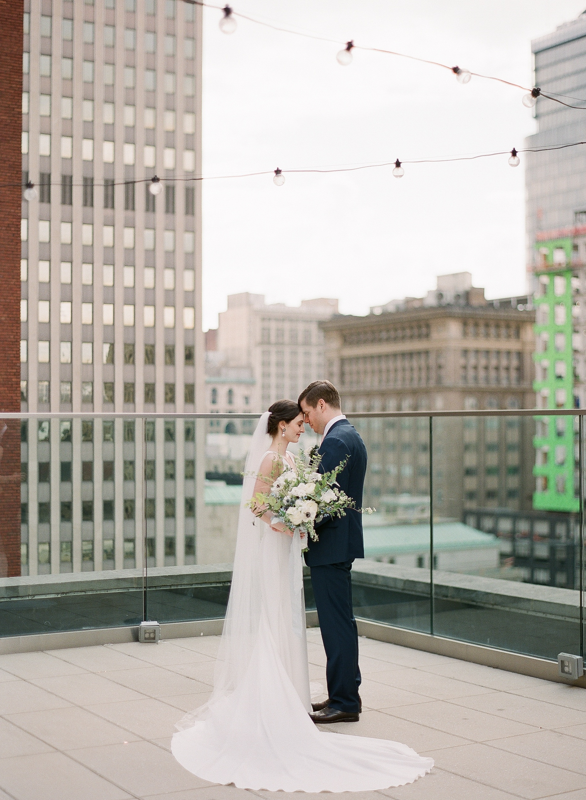 Bride and groom share first look for Pittsburgh wedding at Hotel Monaco planned by Exhale Events. Find more modern wedding ideas at exhale-events.com!