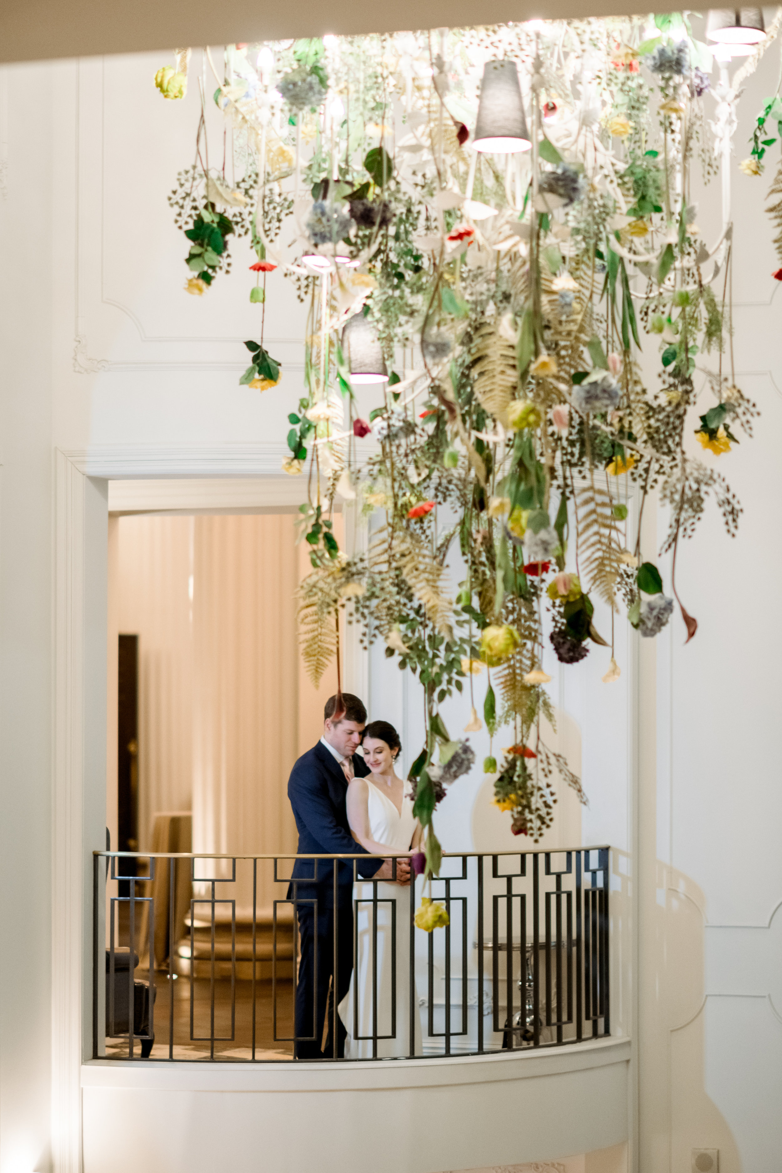 Bride and groom pose for wedding photos for Pittsburgh wedding at Hotel Monaco planned by Exhale Events. Find more modern wedding ideas at exhale-events.com!