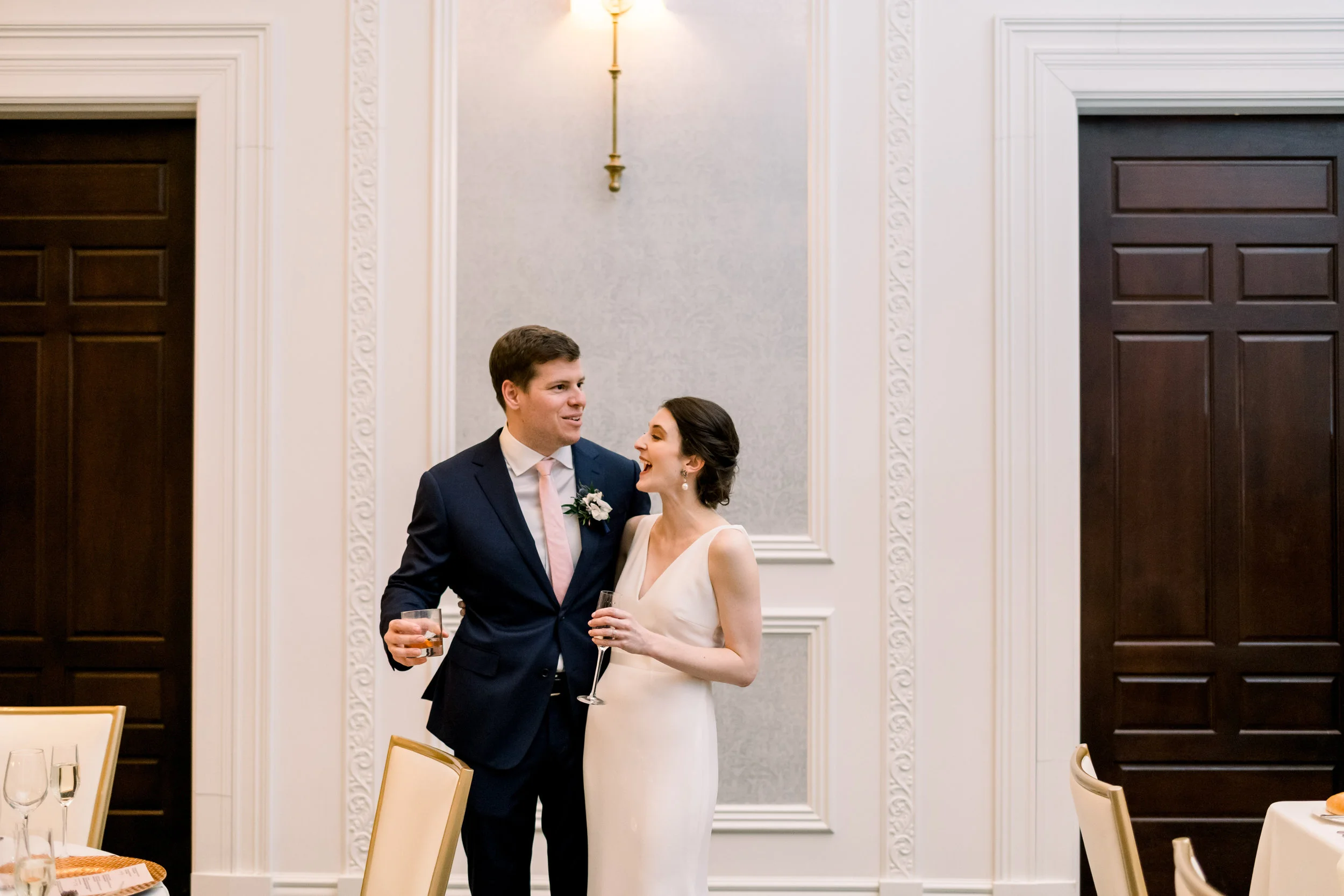 Bride and groom seeing their wedding reception decor for Pittsburgh wedding at Hotel Monaco planned by Exhale Events. Find more modern wedding ideas at exhale-events.com!