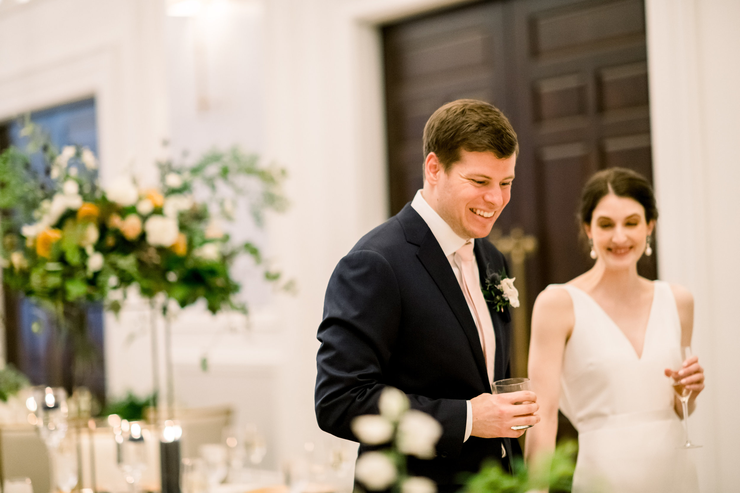Bride and groom seeing their wedding reception decor for Pittsburgh wedding at Hotel Monaco planned by Exhale Events. Find more modern wedding ideas at exhale-events.com!