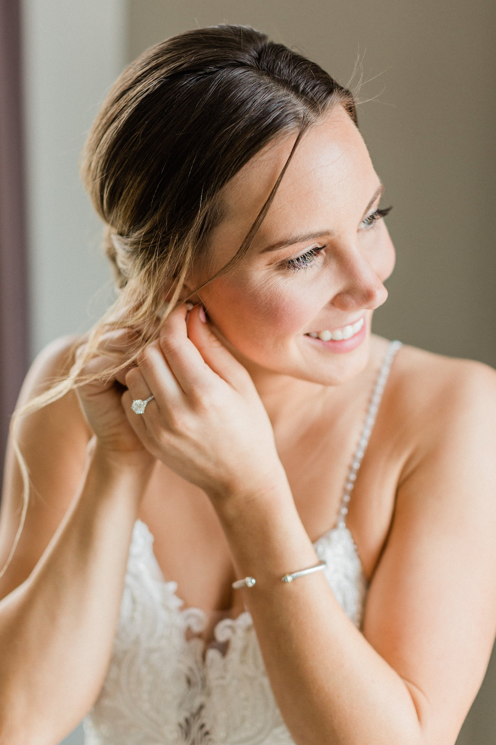 Bride getting ready for chic wedding in Buffalo, NY planned by Exhale Events. Find more timeless wedding inspiration at exhale-events.com!