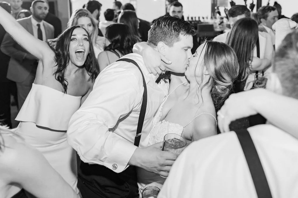 Bride and groom celebrating at chic wedding in Buffalo, NY planned by Exhale Events. Find more timeless wedding inspiration at exhale-events.com!