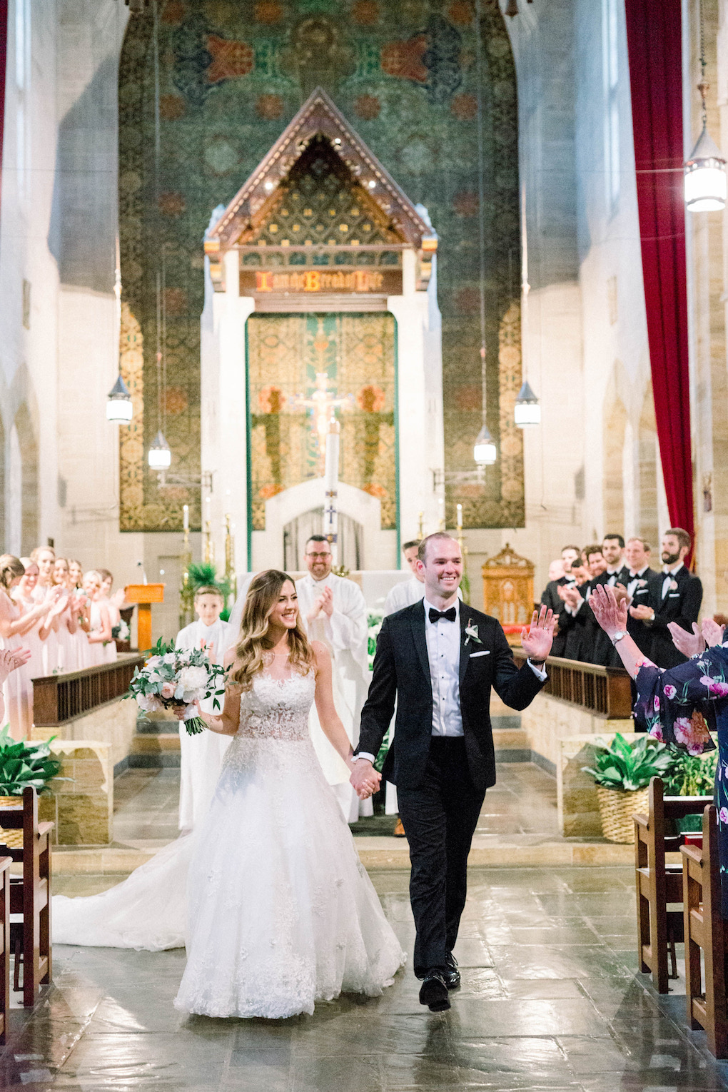 Bride and groom exiting wedding ceremony: Romantic Fairytale wedding at the Omni William Penn in Pittsburgh, PA planned by Exhale Events. Find more wedding inspiration at exhale-events.com!