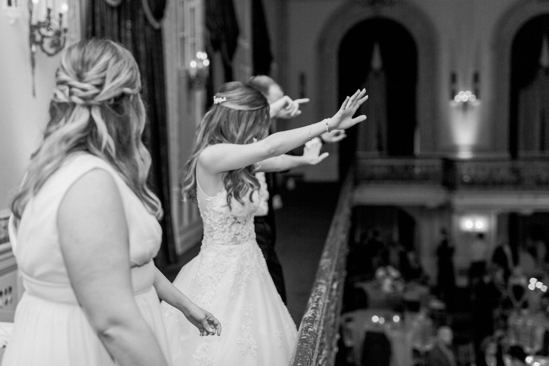 Bride and groom throwing out glow sticks to guests:Romantic Fairytale wedding at the Omni William Penn in Pittsburgh, PA planned by Exhale Events. Find more wedding inspiration at exhale-events.com!