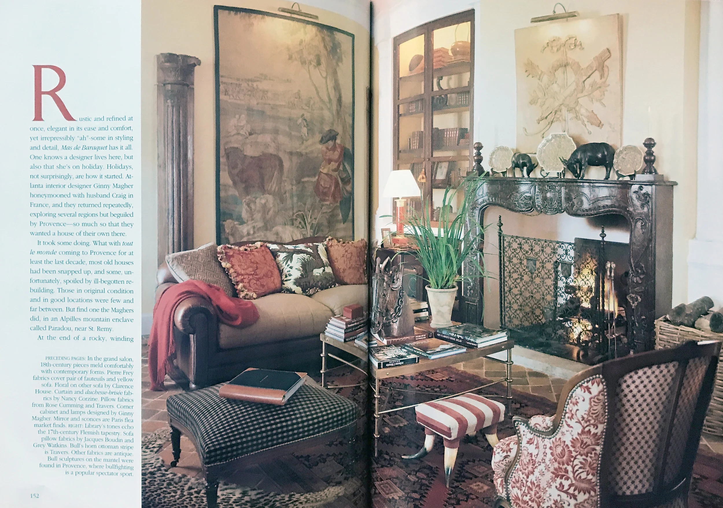 Fireplace, art, and rug in a French living room design by Ginny Magher