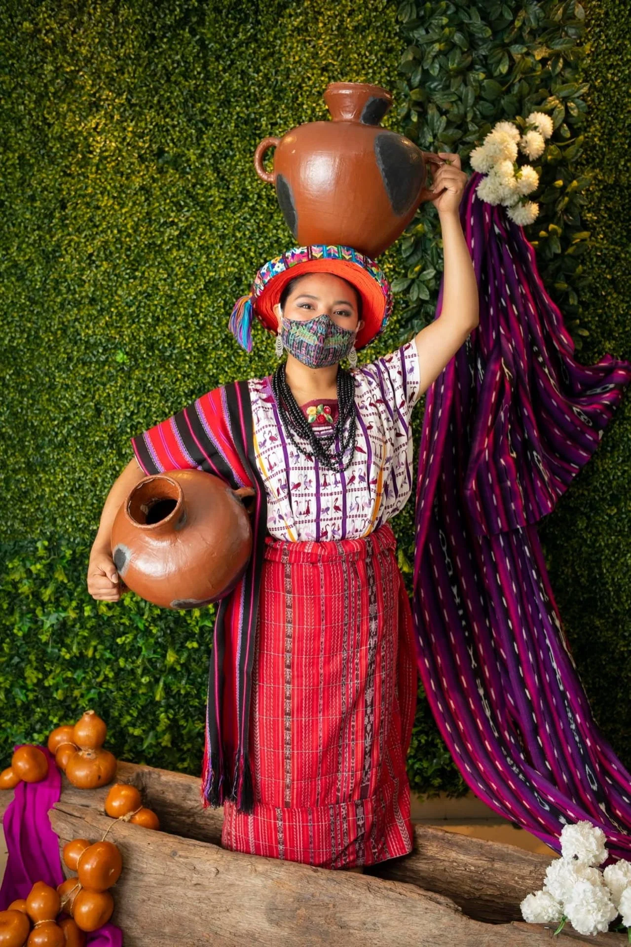 Image of Maya woman in traje in the hallways of La Aurora International Airport to welcome Mexican president Andrés Manuel López Obrador in May 2022.