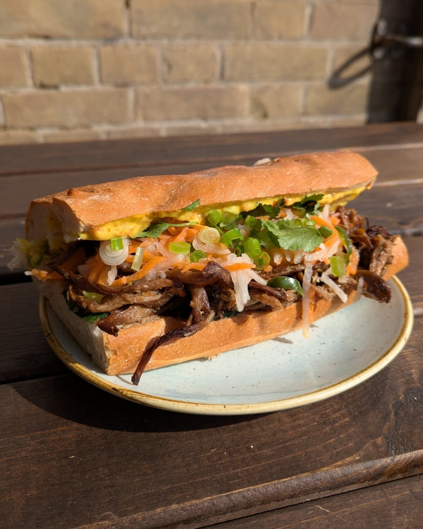 B&aacute;nh m&igrave;, banh you, banh w&igrave;. Lots of deliciousness here - onion &amp; sunflower p&acirc;t&eacute;, chilli sesame mayo, lemongrass Oyster mushroom, pickled carrot, chilli &amp; daikom, spring onions and fresh coriander. Heckin yeah