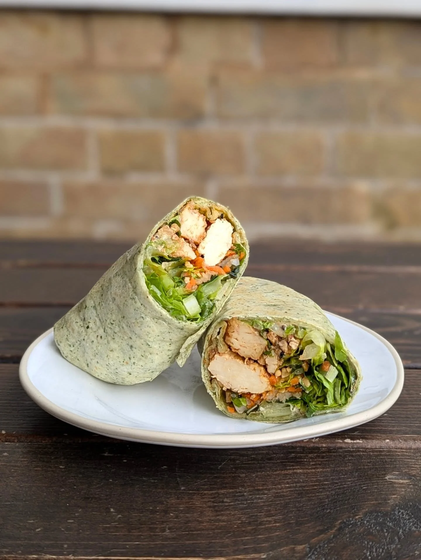 time to formally introduce the wrap:

roasted tofu mixed with chilli crisp 
sesame tahini sauce (yes that very same one)
pickled daikon, carrot and chilli
coriander, mint &amp; spring onion
toasted peanuts
lettuce &amp; cucumber

super crunchy and fr