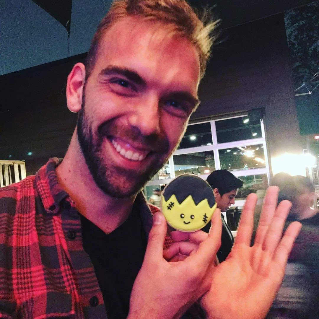 Here is a picture of Zach holding a miniature cookie version of himself!