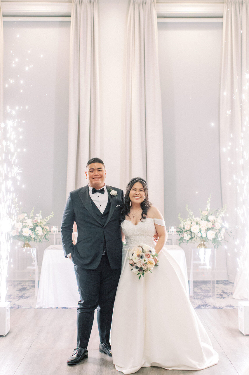 Bride and groom with indoor sparklers at Fairmont Palliser Hotel Wedding.jpg