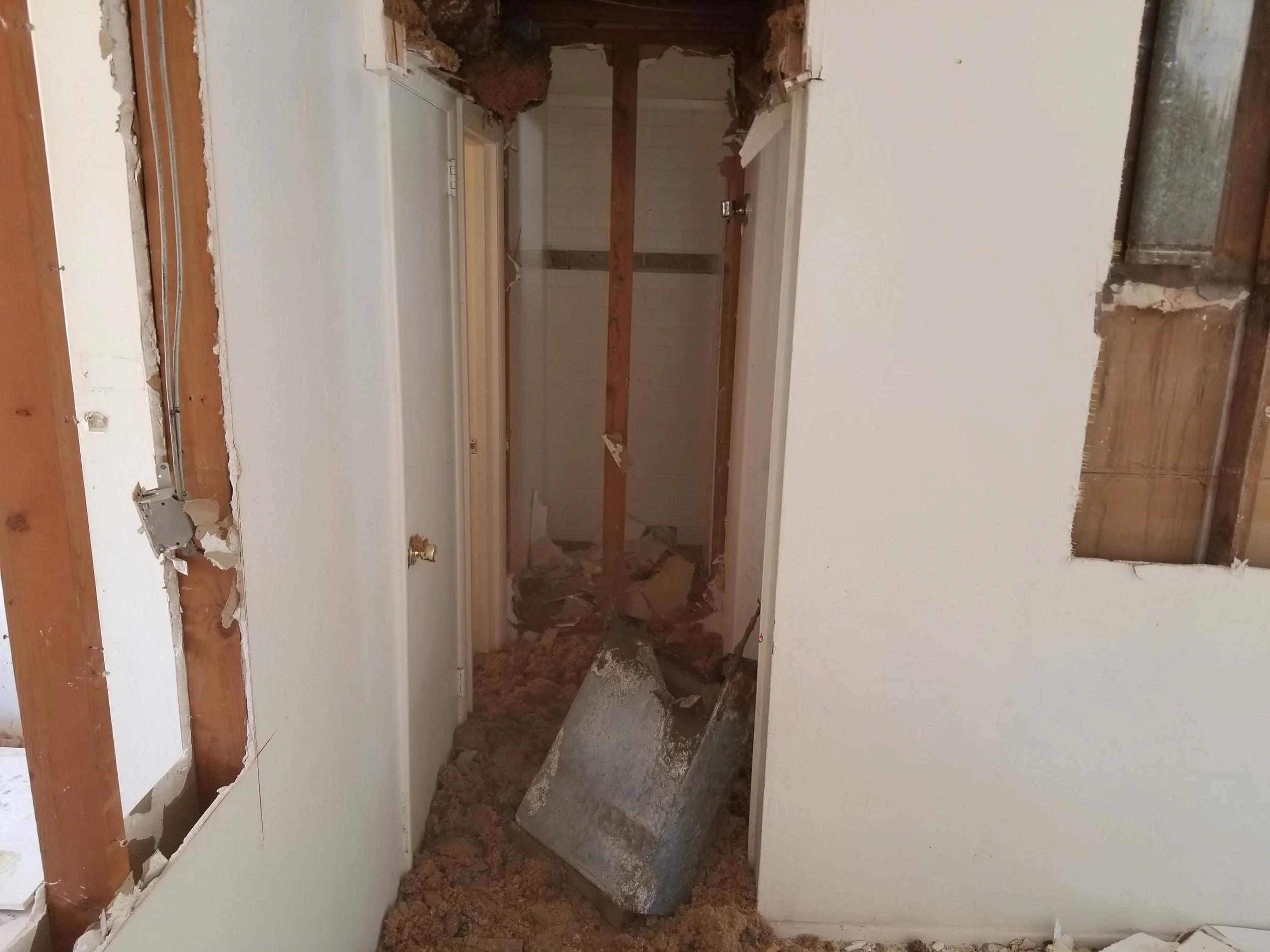 Hall way ceiling and wall demolition. Extending the hallway to the new bedroom addition.
