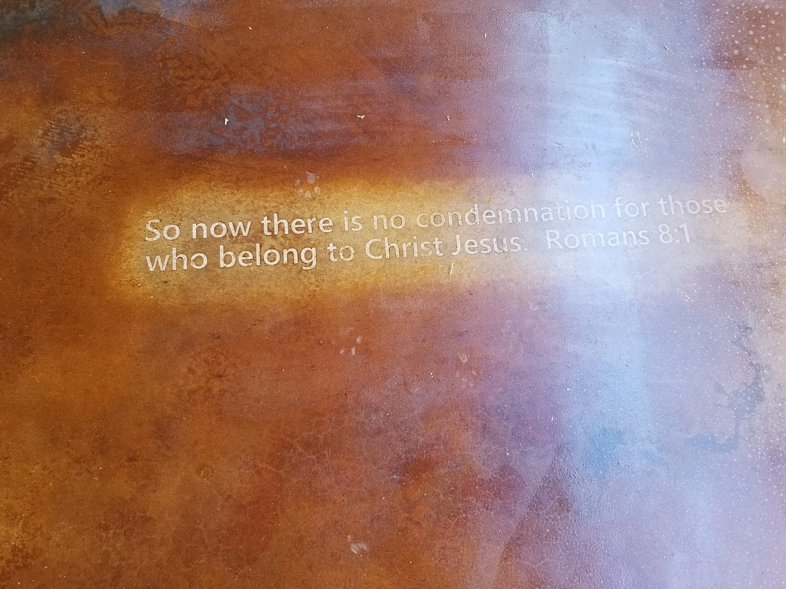 We acid stained scripture into the concrete of the patio and the bedroom floors.