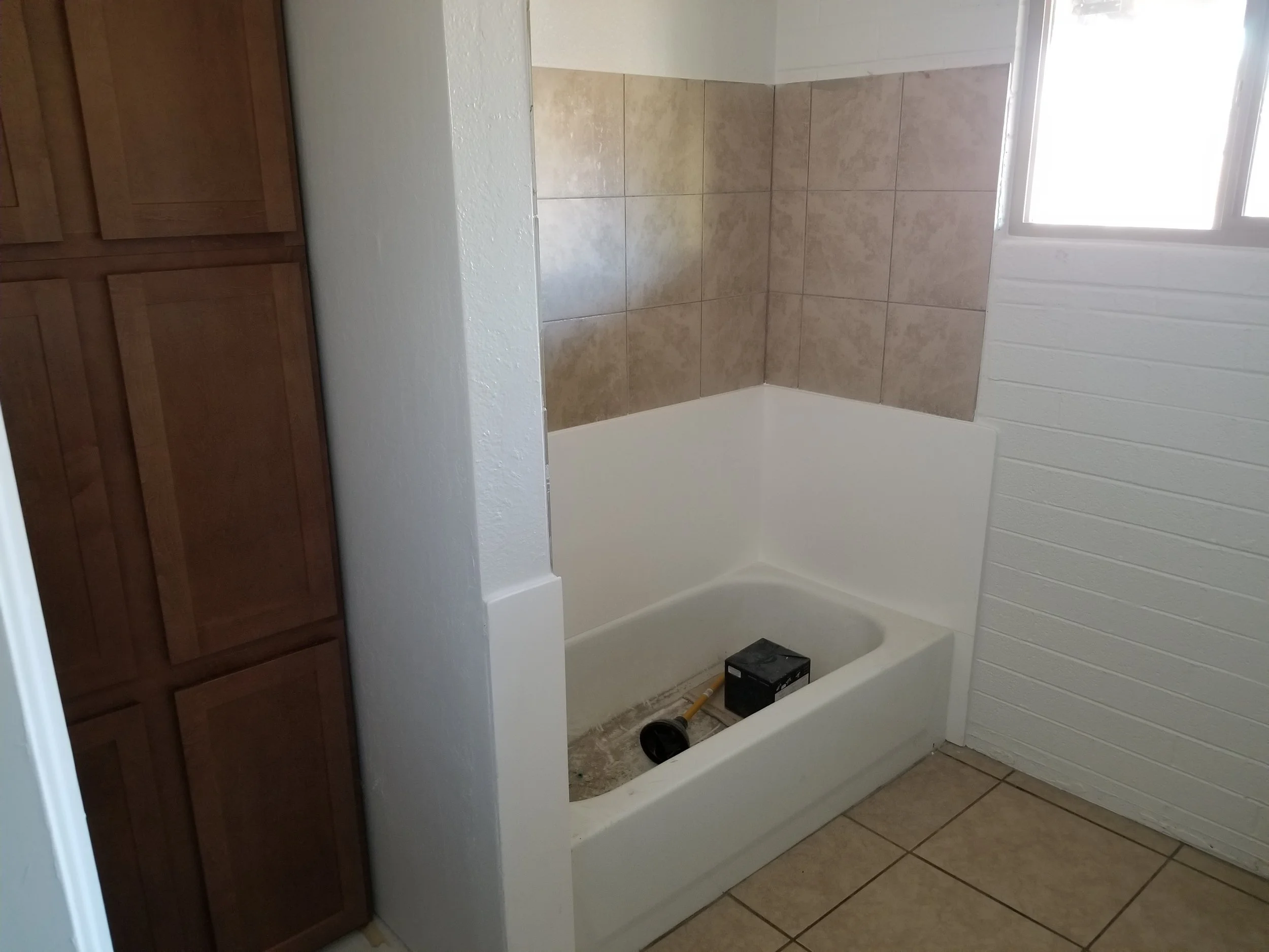 New bathroom cabinets, new shower surround, new plumbing