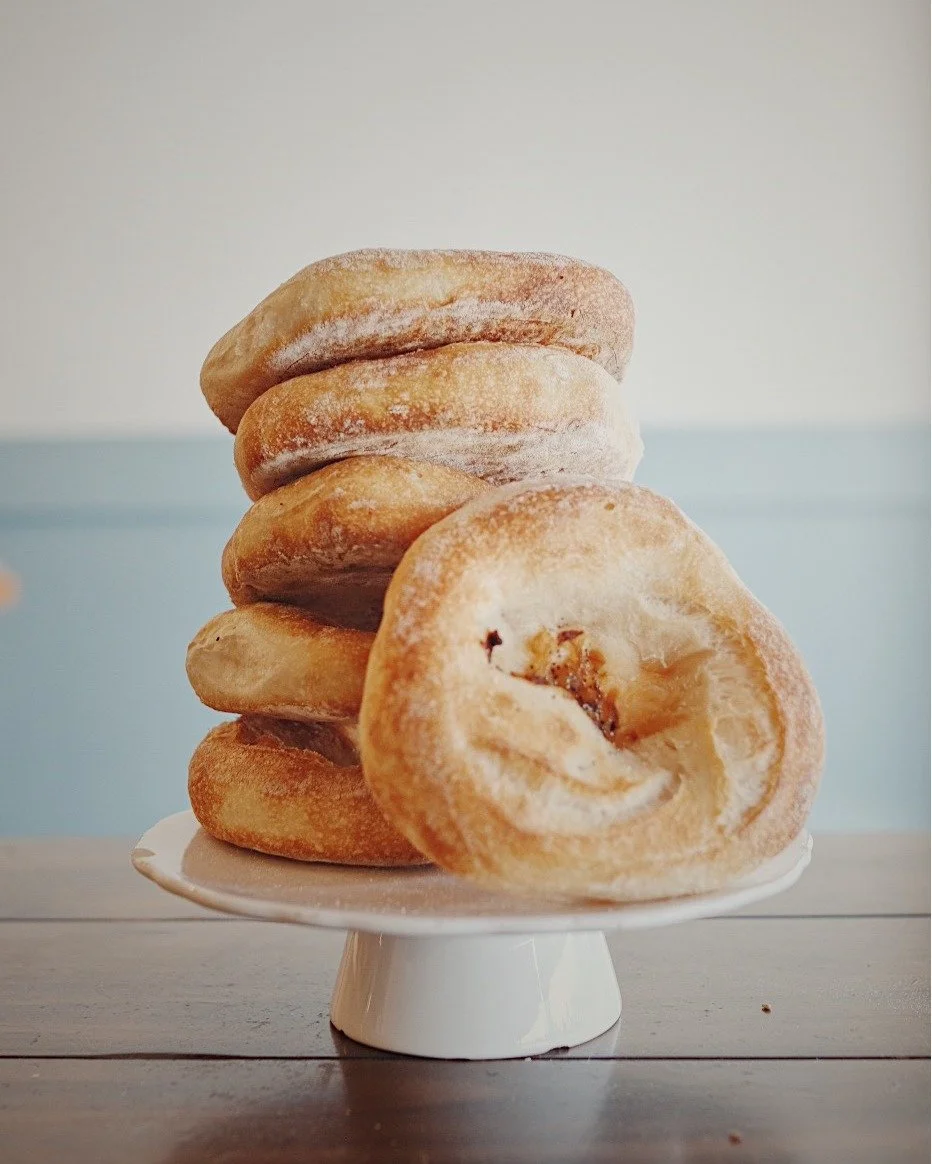 Originating from Polish cuisine, the bialy is one of our longtime favorites here at UBC.
And just to be clear &mdash; it&rsquo;s not a bagel. It&rsquo;s its own thing. Round with a soft, chewy bite, a slightly depressed center filled with cooked onio