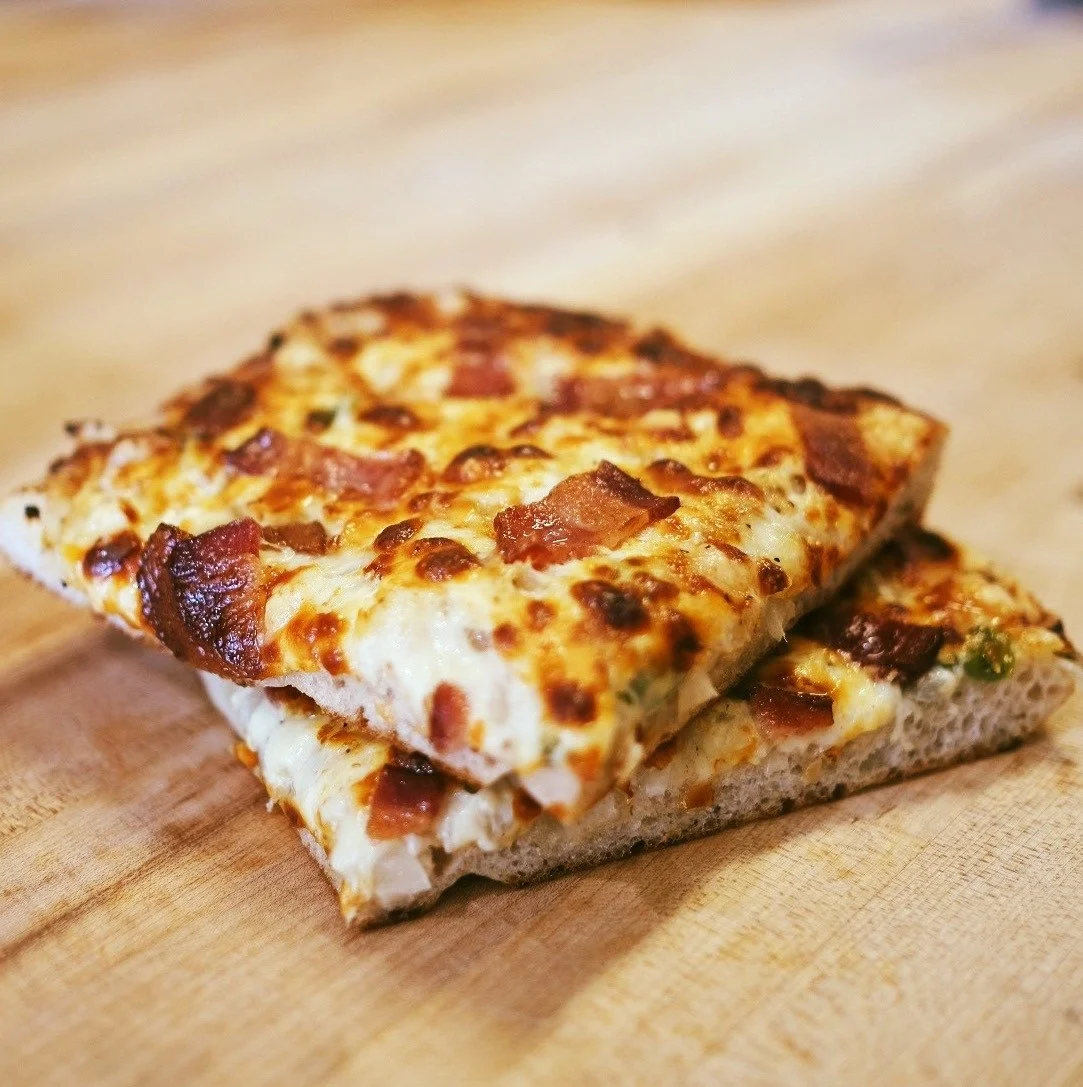Last call for Friday pizza.
If you were thinking about it, this is your reminder to get those orders in. Our focaccia pizzas are available for Friday pickup, and the online store is open now.
Baked fresh, simple, and easy to reheat at home. Just pop 