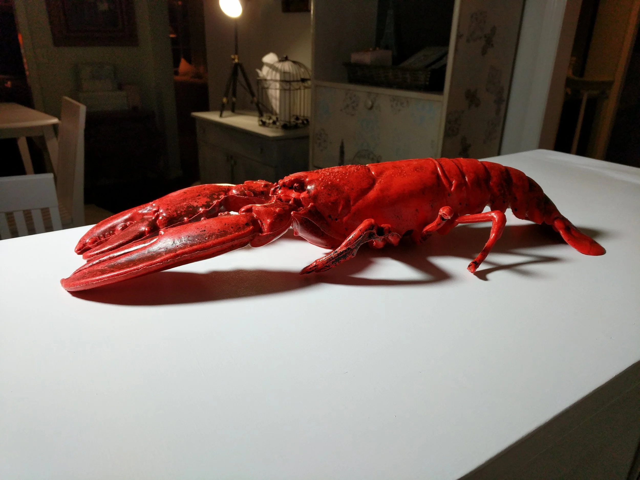 Rock Lobstah! I'm now dying to paint something with a coastal kind of finish. This guy has a long, useful life ahead of him. Wonder if I can get a bumper sticker announcing that I'm the "mom" of a rescue lobster? I think I'll name him Butterman.