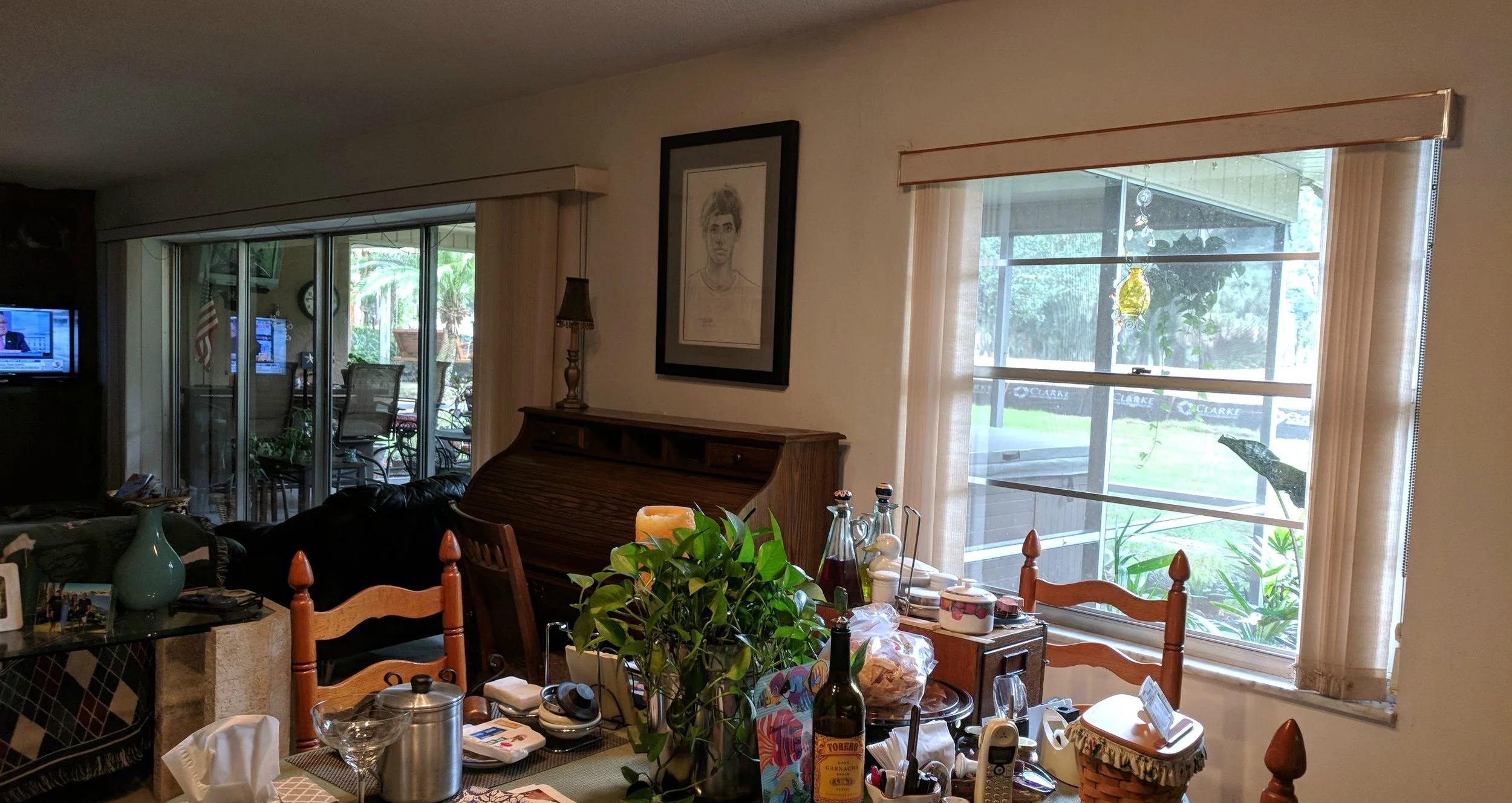 This is the other side of the living room. That sliding door is bigger than many garage doors. The windows are just amazing. And, yes, I had the tv on the whole time because they have cable! We don't have cable. I binged on HGTV and bad movies. Still having withdrawals.