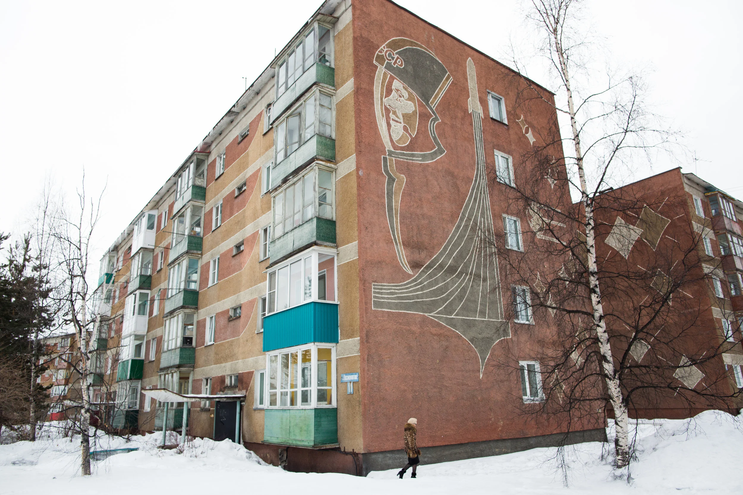 Soviet remnants on the side of an apartment block in Milkovo, Kamchatka. Photo: Karim Iliya.