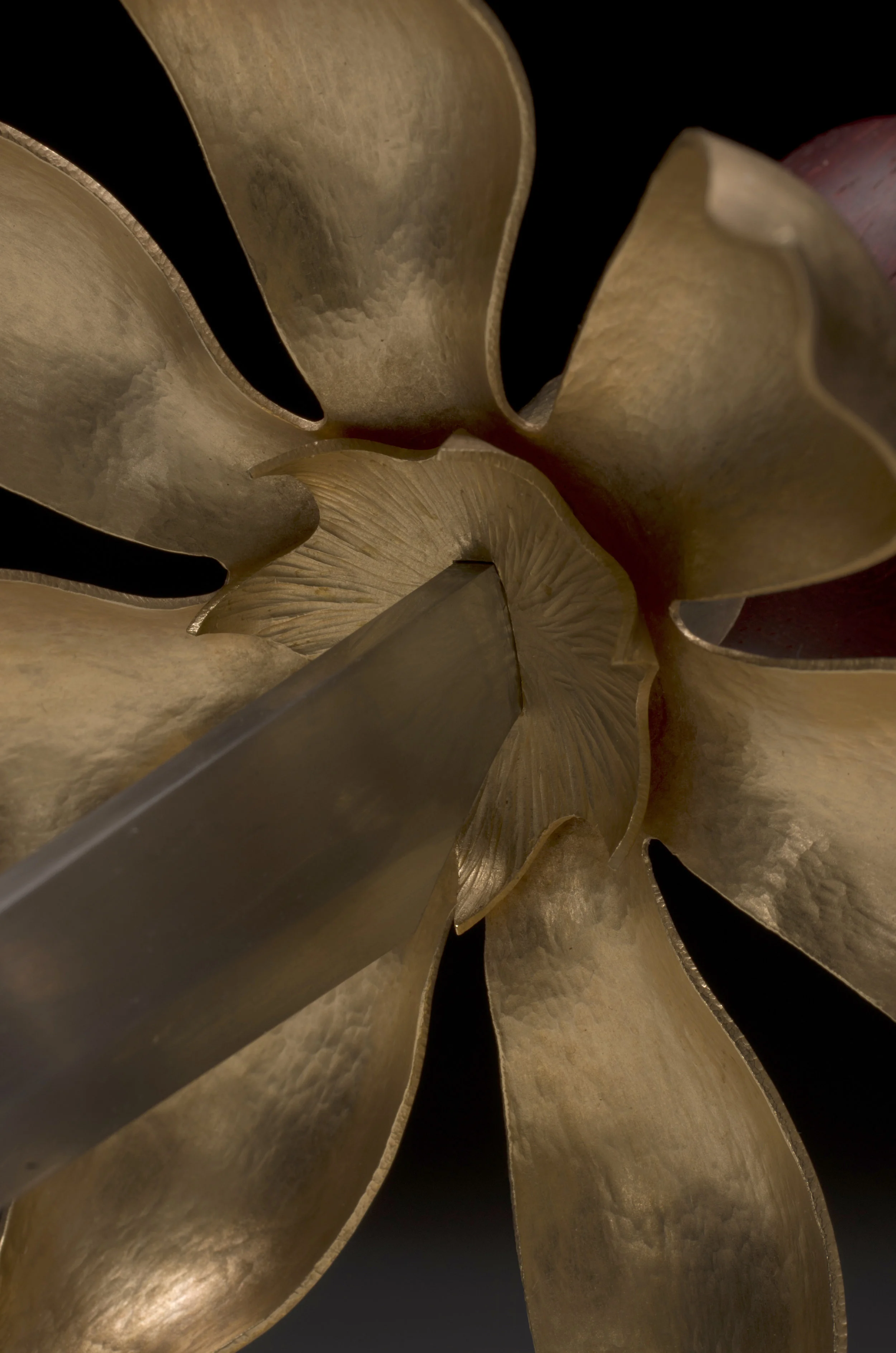  At the altar, a symbolic meal of flesh and blood dramatizes the eternal themes of birth, death and sacrifice. The heart is transfixed by poetry, even as the mind suspects a fiction.  2012; raised, pierced and sterling silver and bronze,&nbsp;carved 