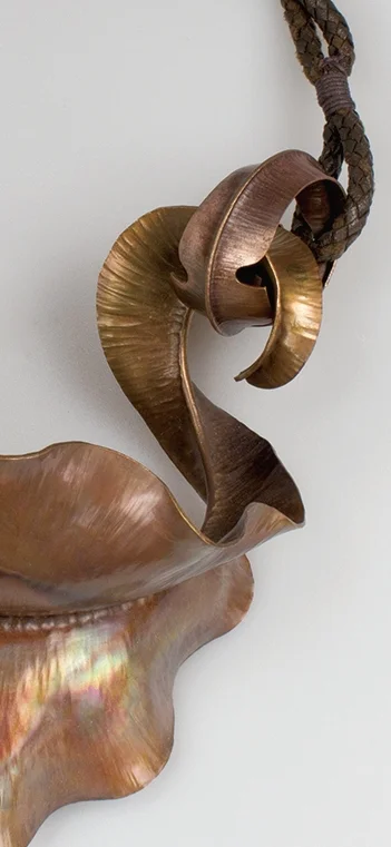  'por frida' neckpiece homage to Frida Kahlo  foldformed and raised bronze, braided leather cord 