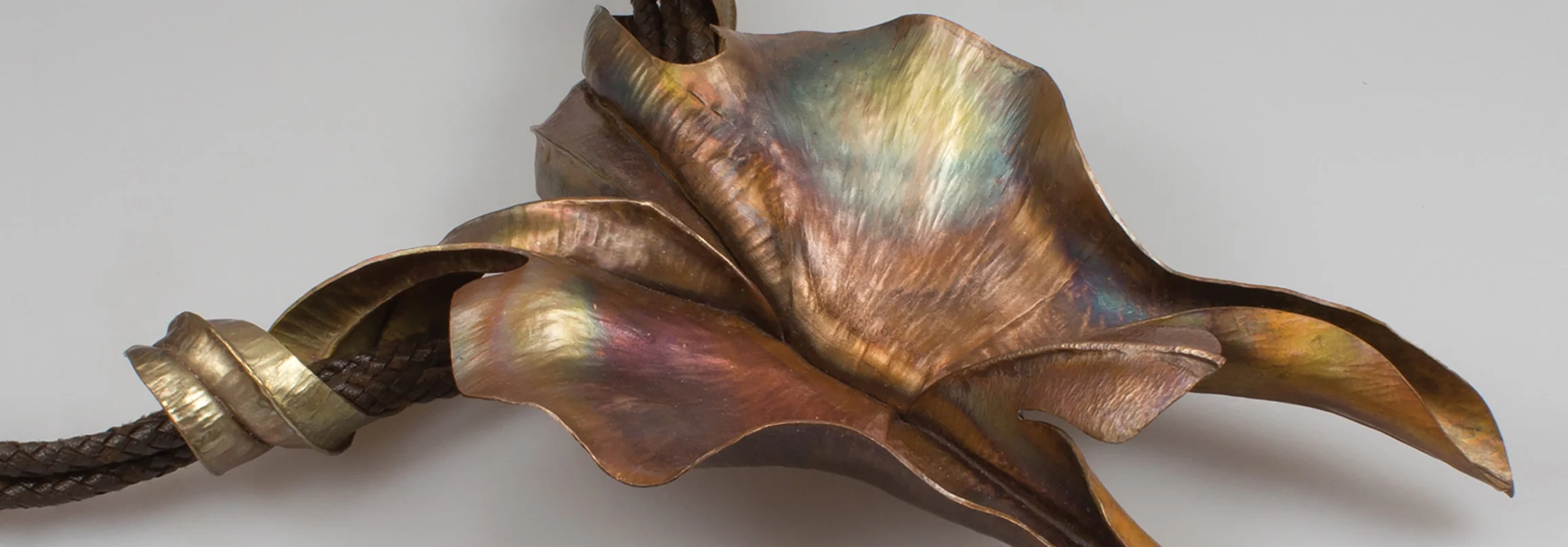  'georgia's orchid' neckpiece homage to georgia o'keeffe  foldformed and raised bronze, braided leather cord 