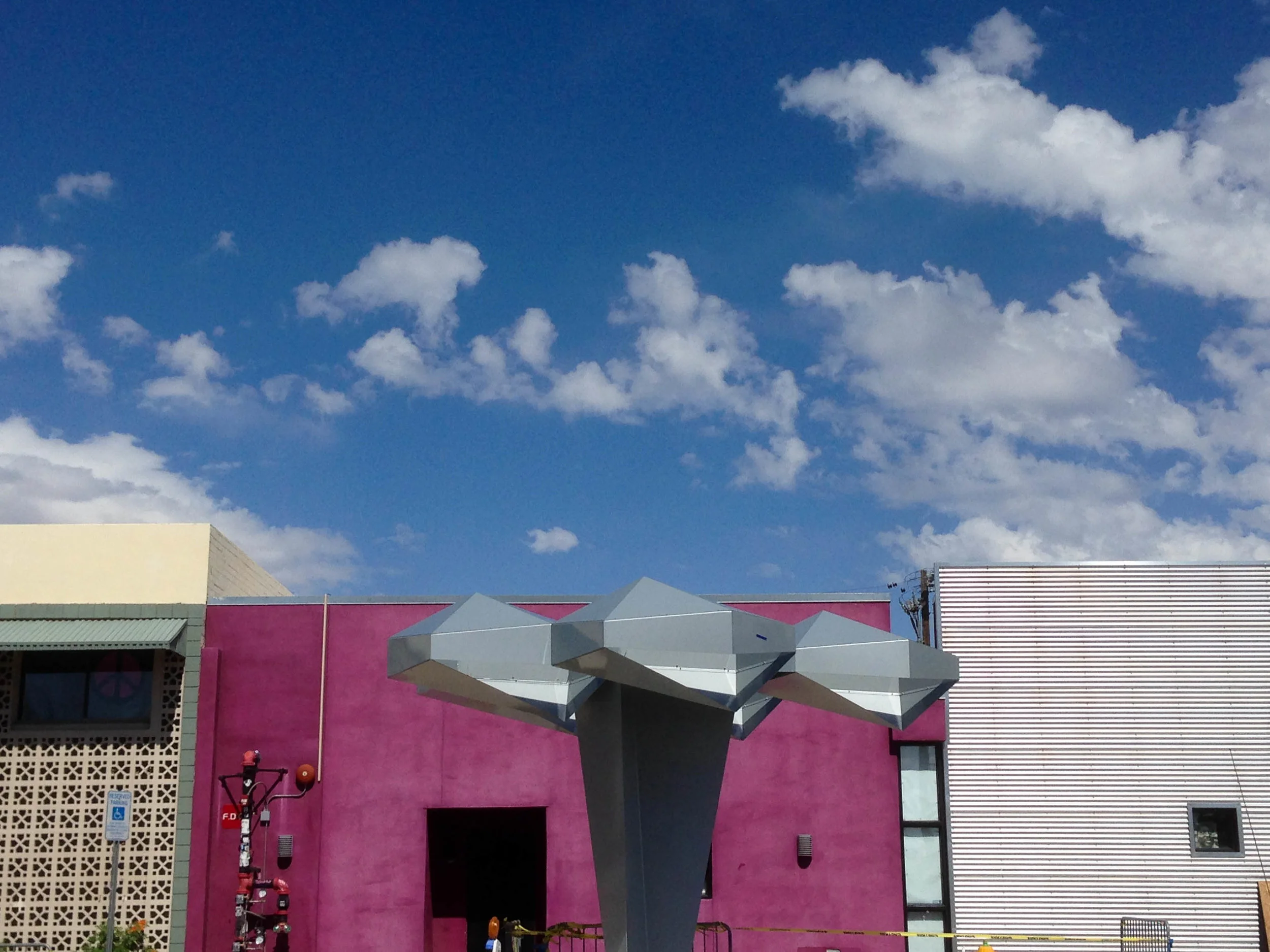 A futuristic statue provides shade for summer days on Roosevelt Row, downtown Phoenix's art district. 