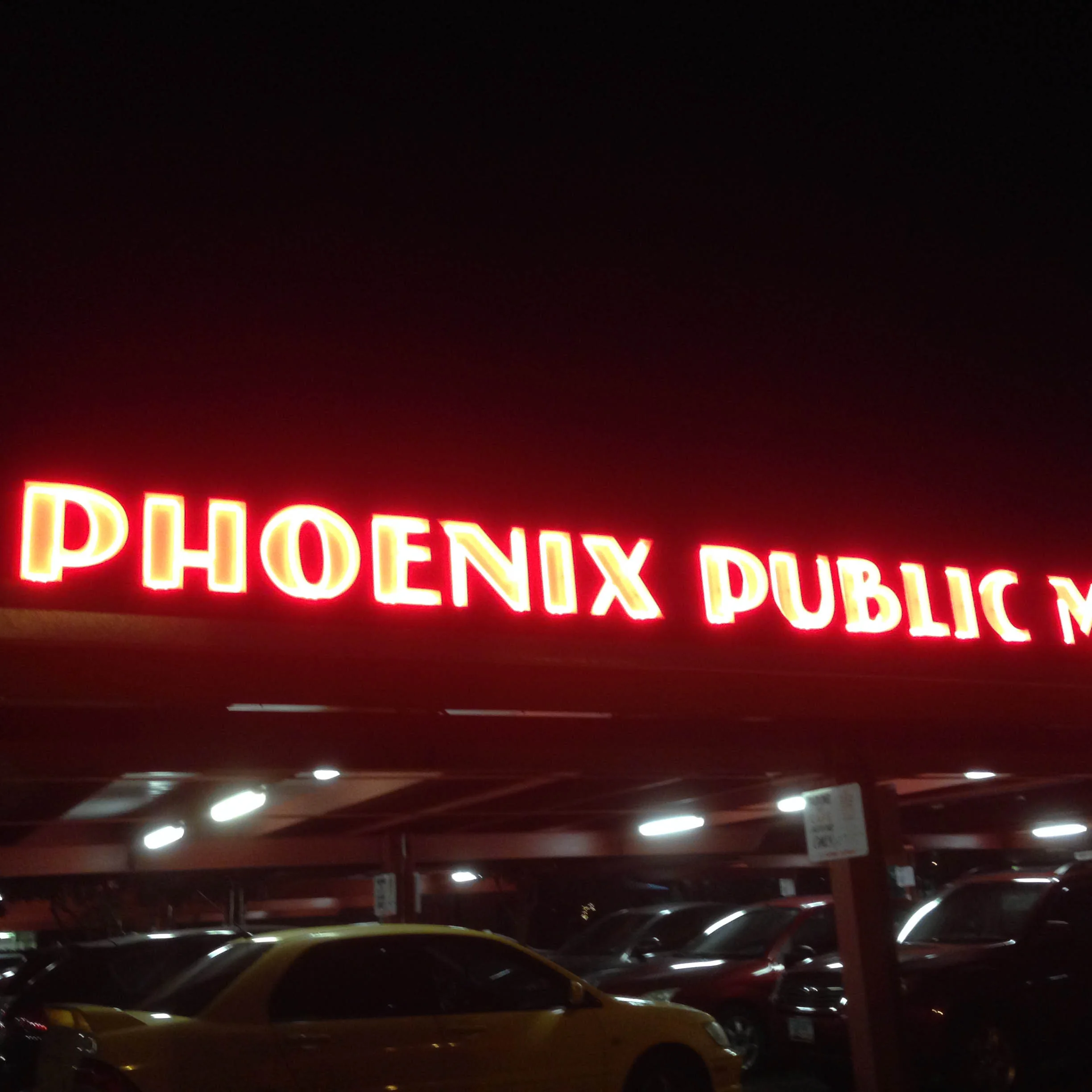  Phoenix Public Market's red neon sign draws in visitors on hot summer nights.&nbsp; 