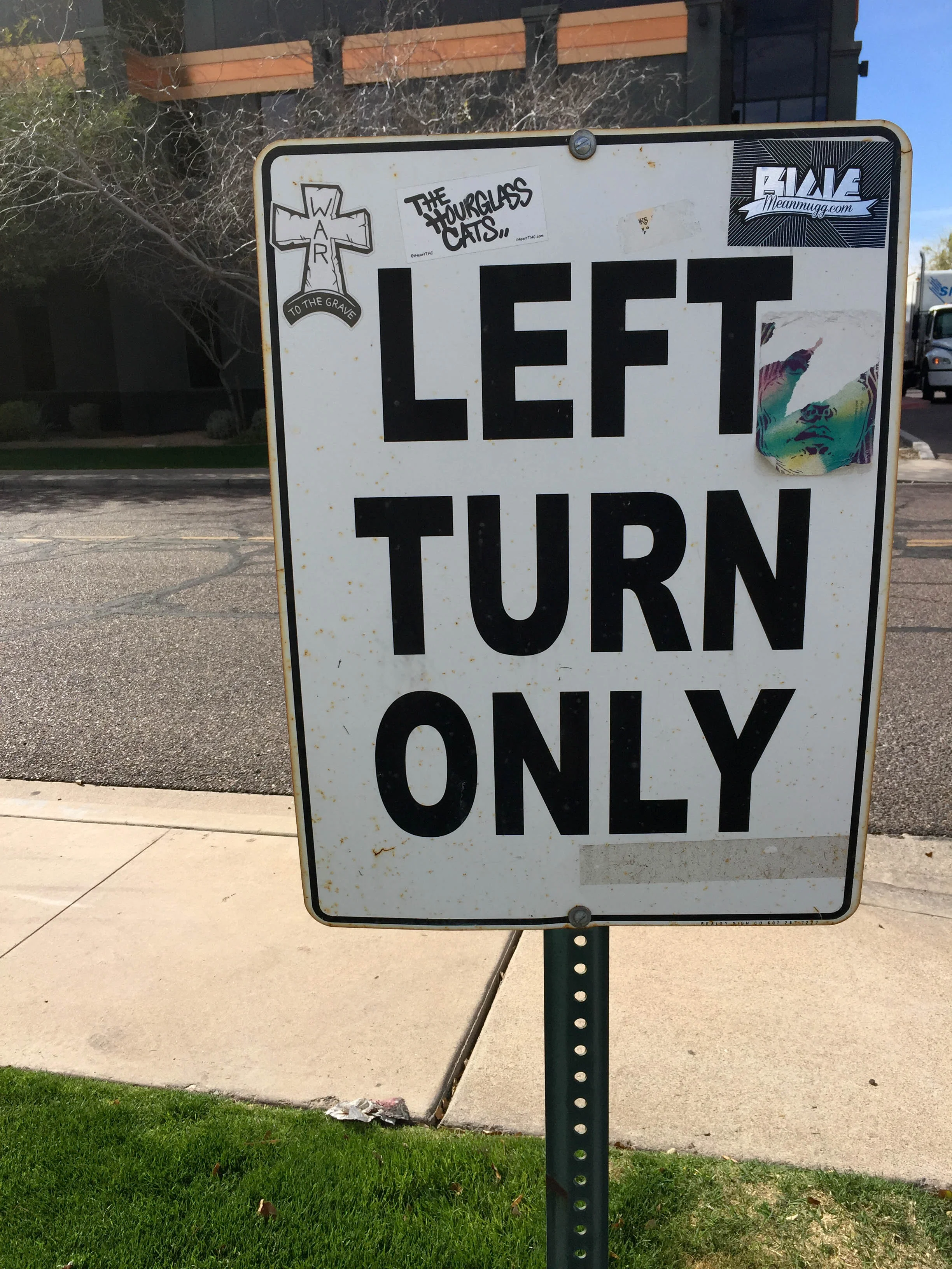 Visitors leave their mark on a street sign outside Half Price Books in Phoenix.