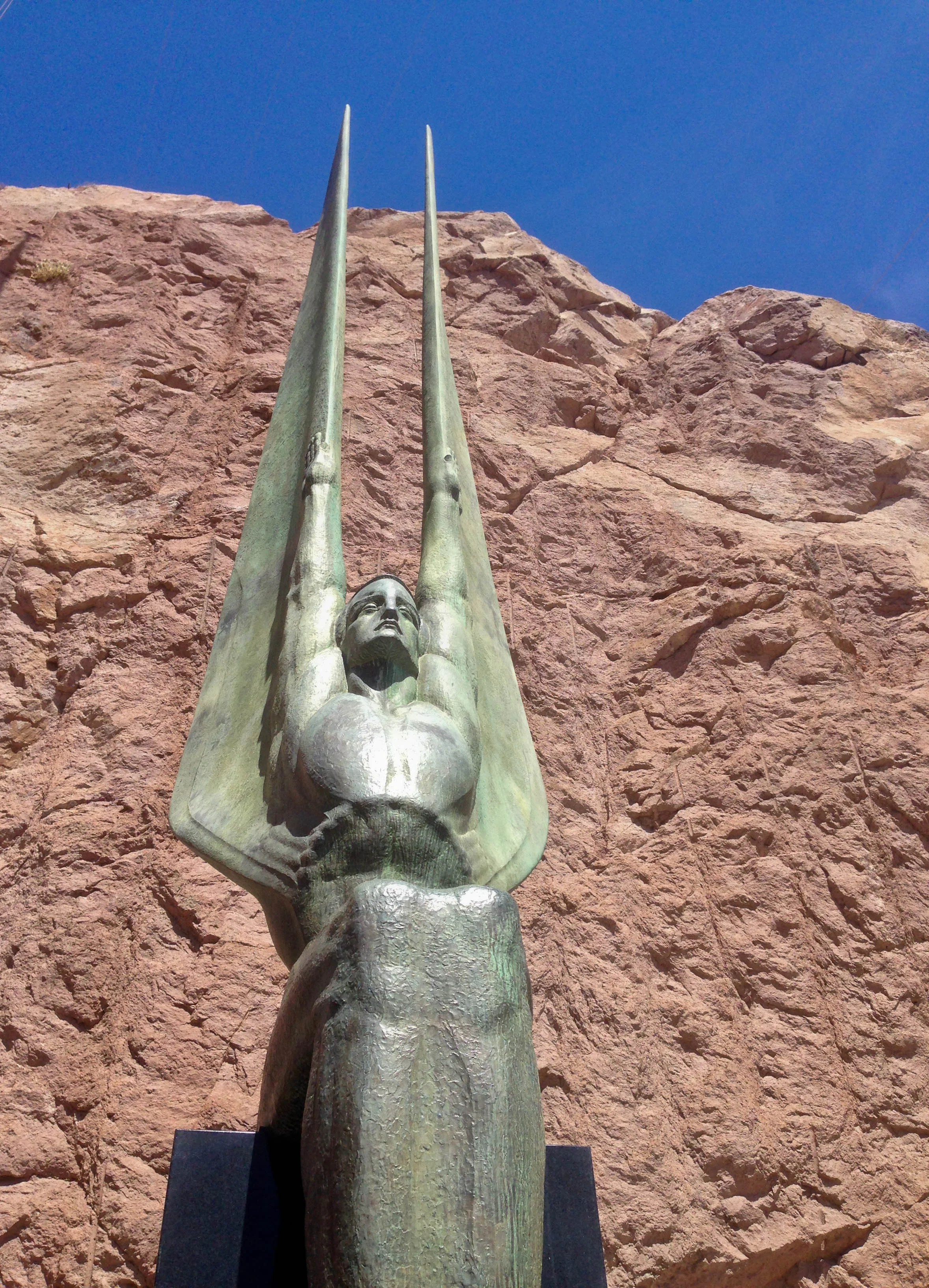  One of the Winged Figures of the Republic, sculptures by Oskar J.W. Hansen near Hoover Dam. Hansen said they hey express "the immutable calm of intellectual resolution, and the enormous power of trained physical strength, equally enthroned in placid
