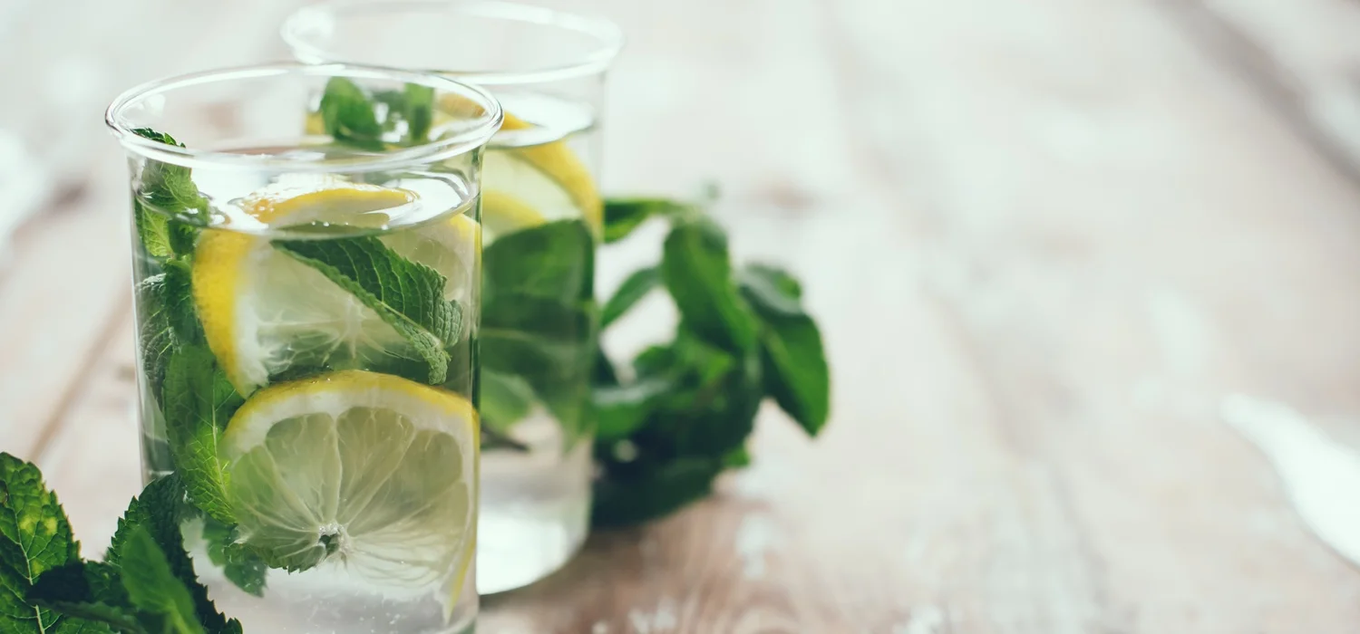 lemon-herbs-water-in-glass-to-promote-eating-healthy.jpg