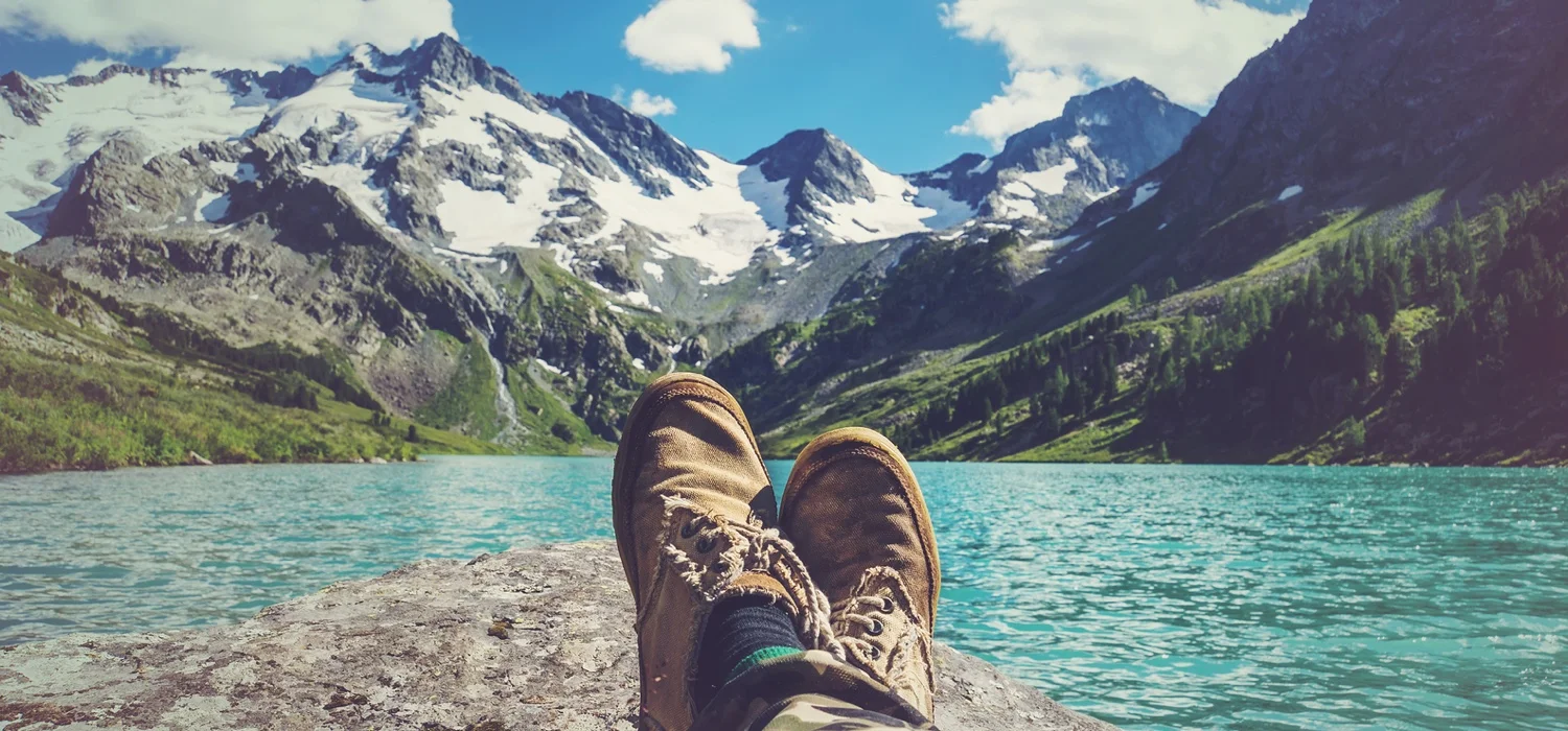 healthy-man-relaxing-by-lake-and-mountians-thinking-about-the-future.jpg
