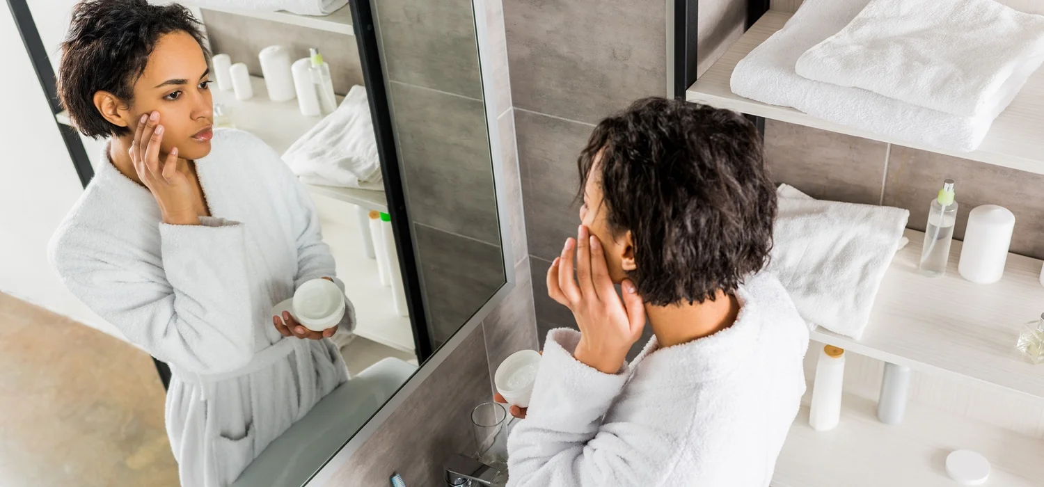 woman-looking-at-face-Interpret-Skin-Conditions.jpg