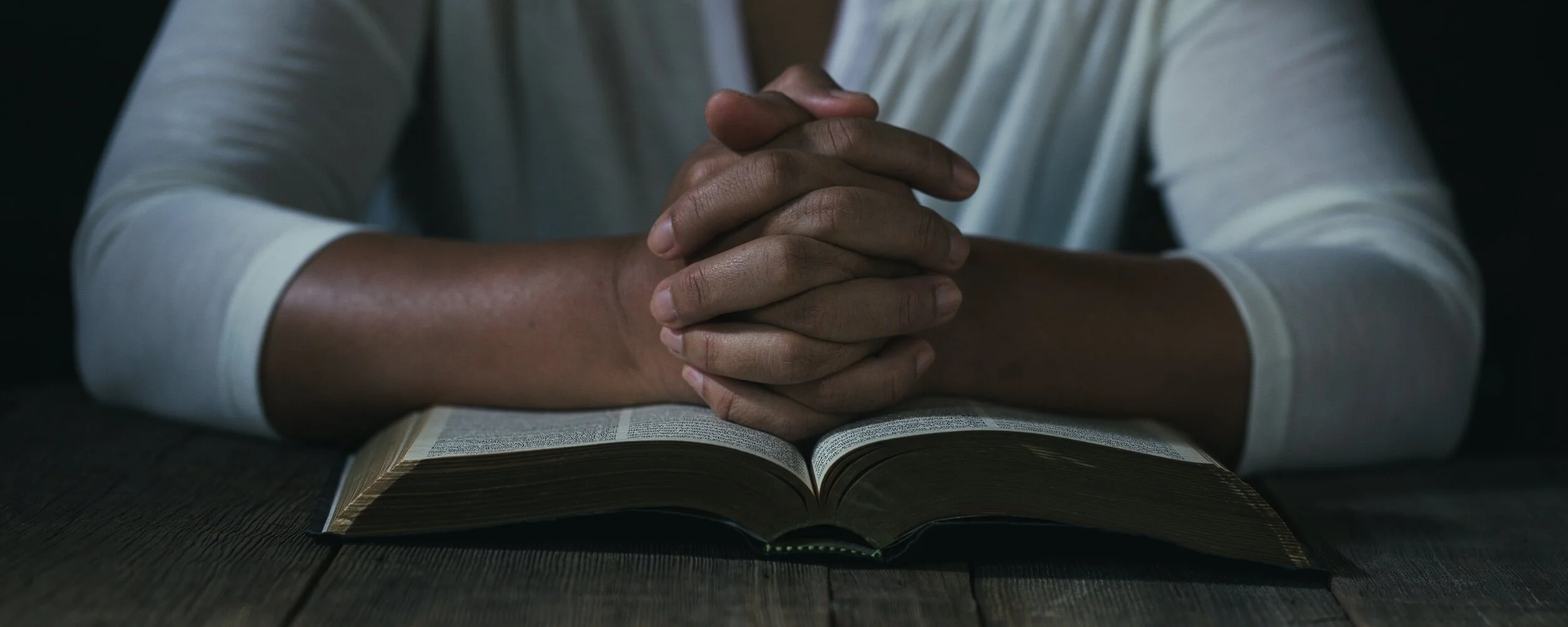 Man fasting, reading the Bible, and praying about .jpg