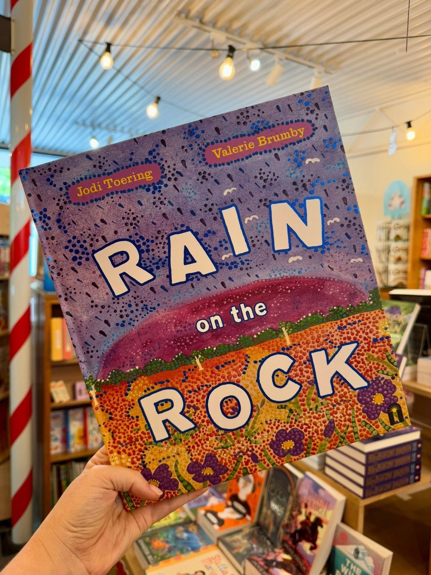 For as long as I can remember, I&rsquo;ve dreamed of visiting Uluṟu on one of those special, rare days where rainfalls cascade down the rock.

Rain on the Rock features stunning paintings by Valerie Brumby, one of the core artists at Walkatjara Art, 
