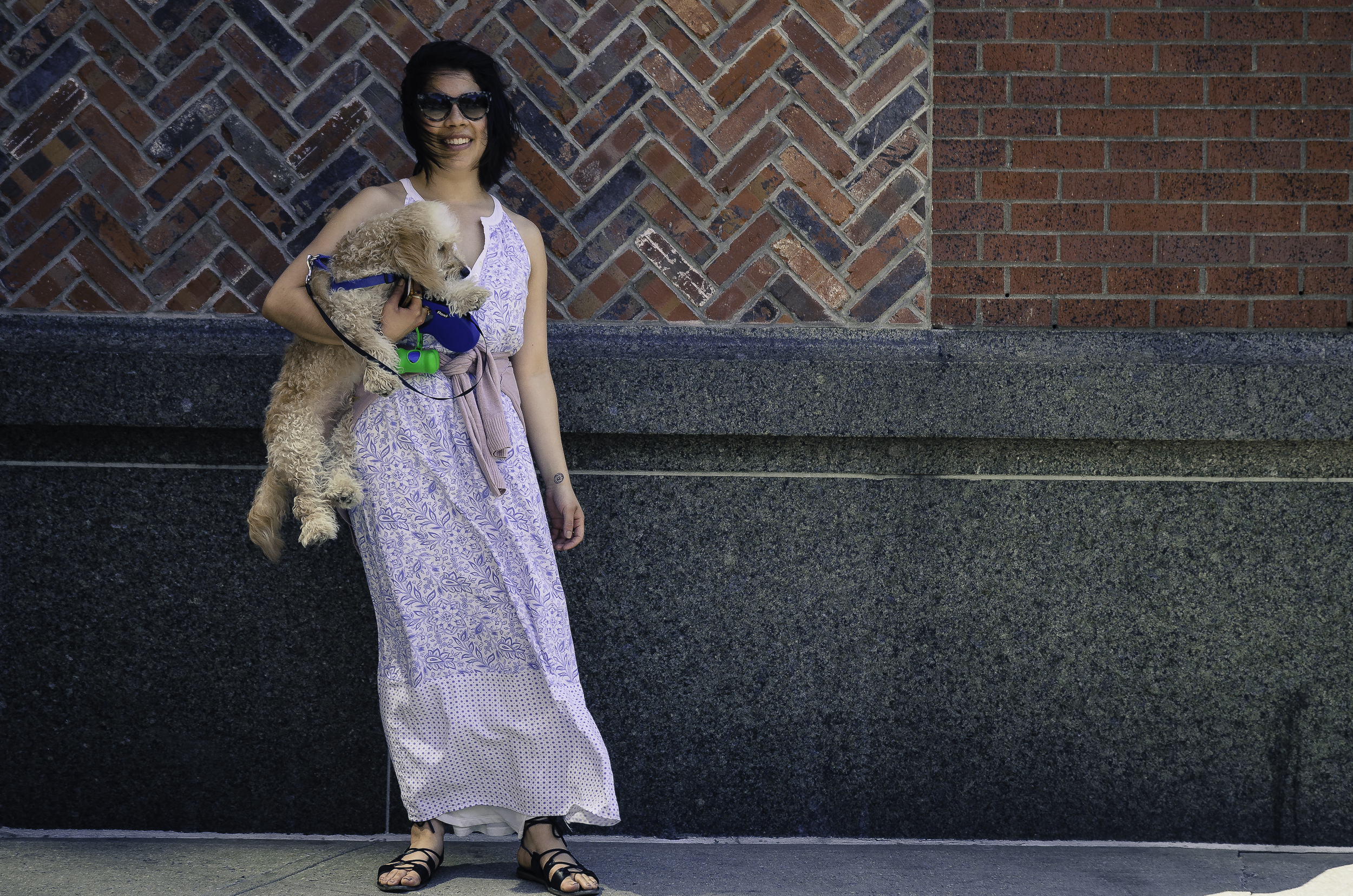 Her Old Navy dress is light and adaptive for the demands of a dog walk. She also wears Thierry Lasry sunglasses to keep the sun at bay.