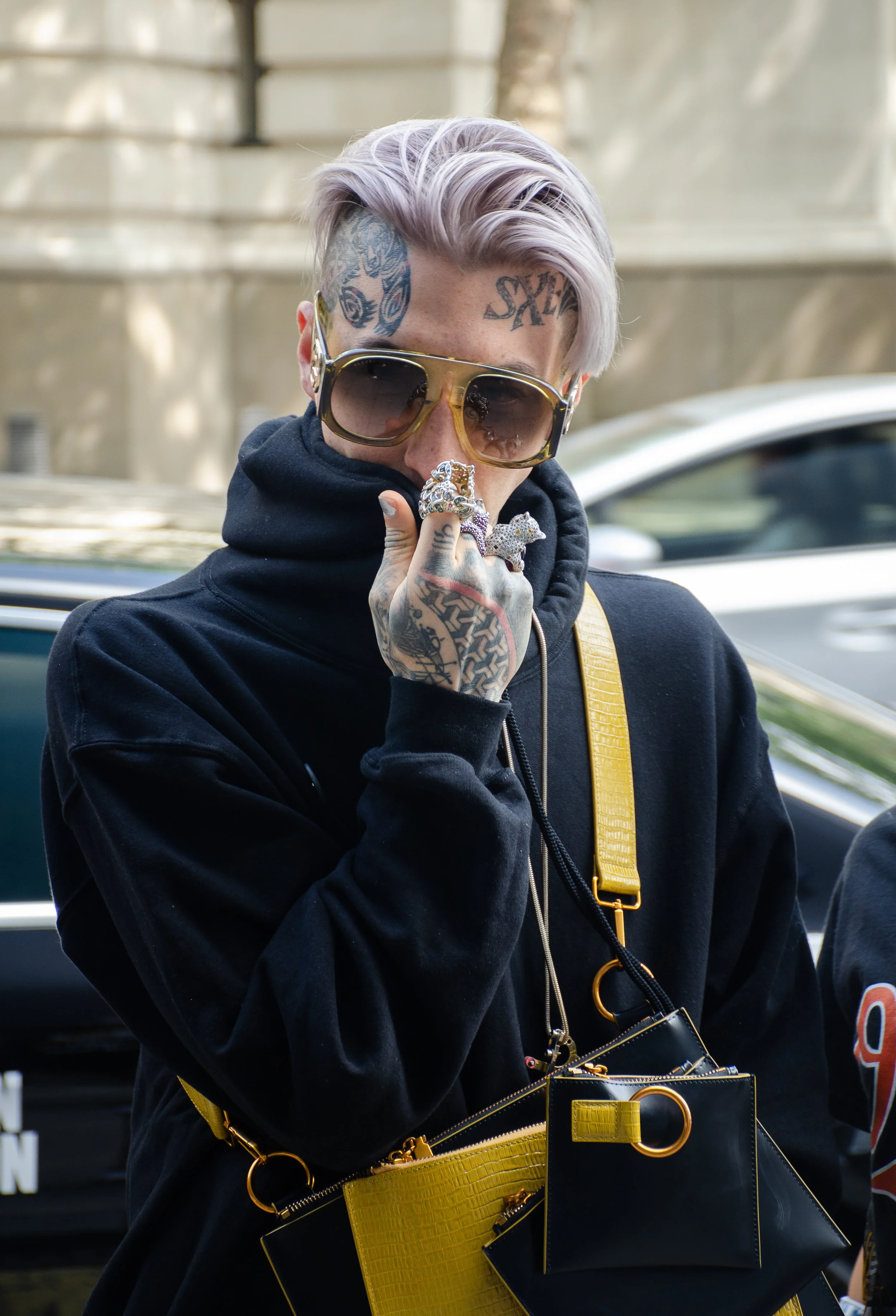 Here, Chris Lavish looks mischievously stylish. As per his signature style, his jewelry, accessories, and (most importantly) tattoos do the work.