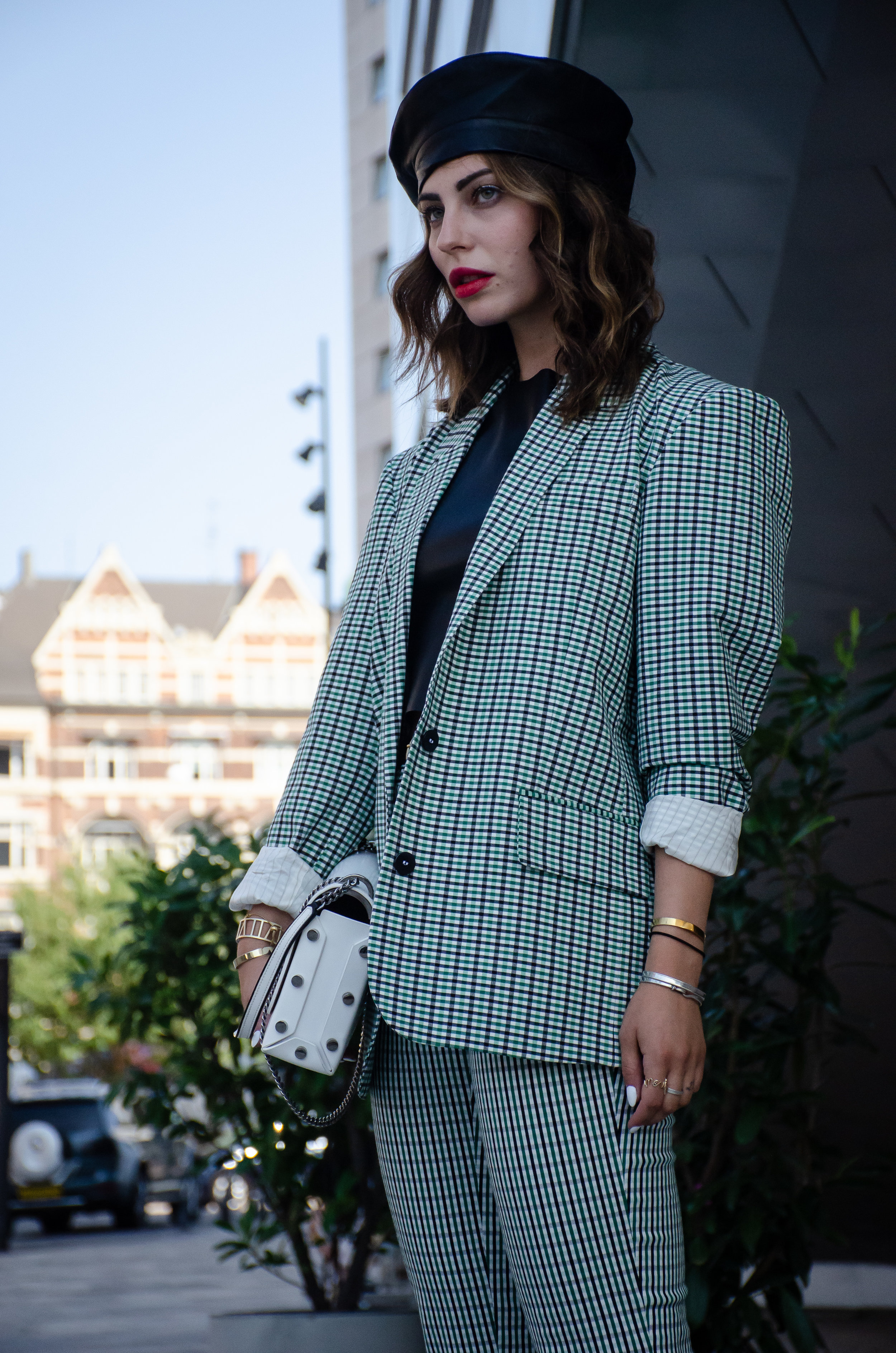 Maria Astor pays homage to the historical use of the beret (as part of military uniform, and extreme style); The beret fits with her blazer’s militaristic shoulder pads, and amplifies the fashion statement made by her suit.