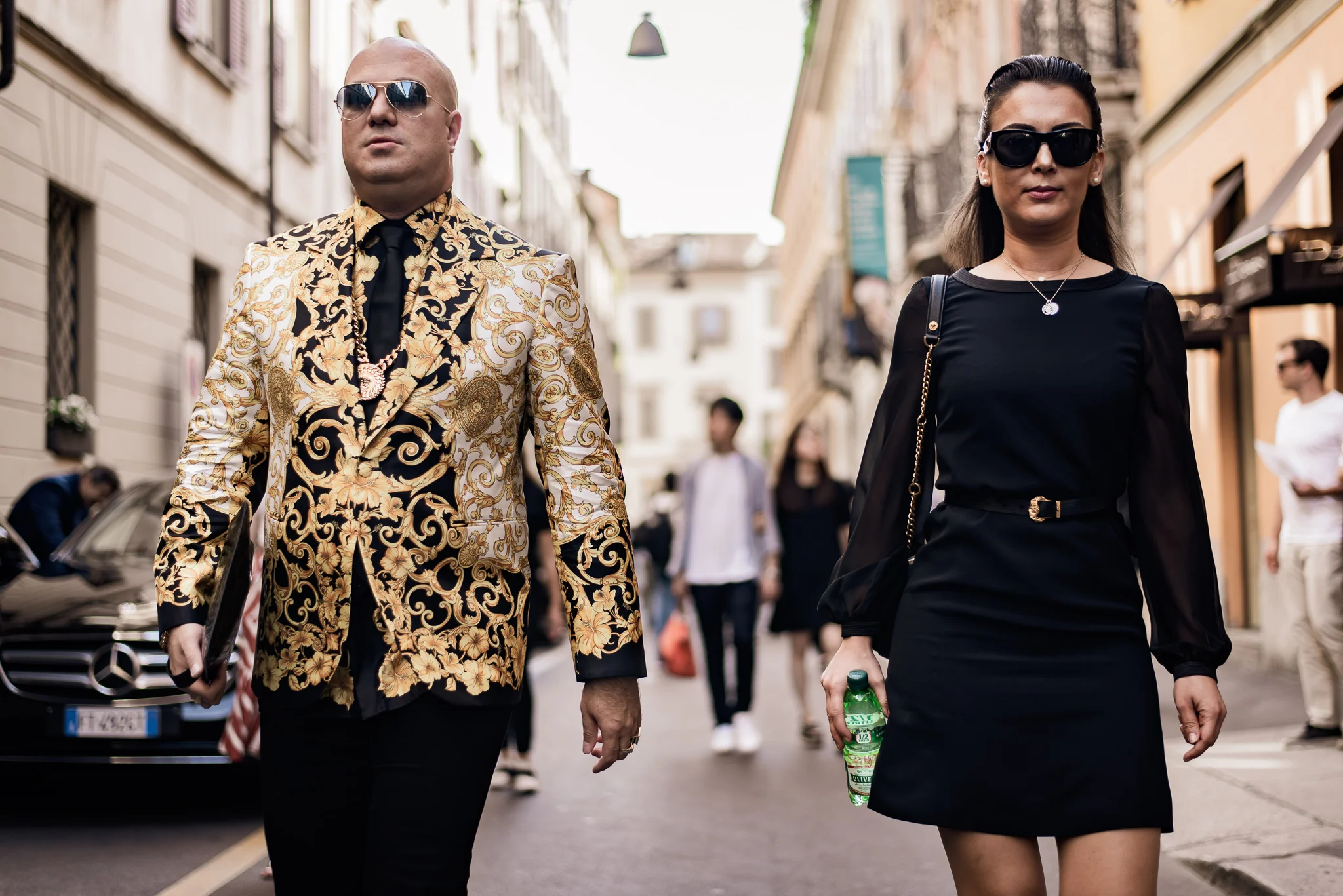 The Dictator and his bodyguard strolled through Milan like they run the city (or, another part of the world lol)