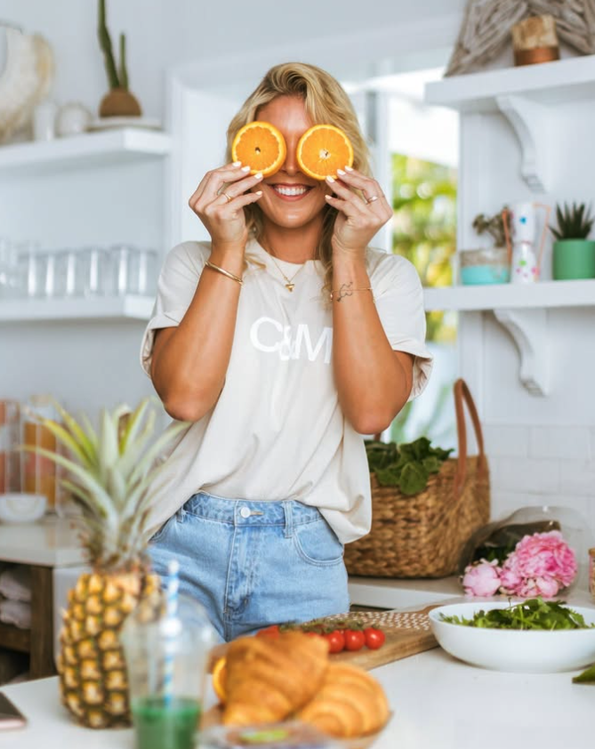 Health coach Tori with fresh produce, branding photography Brisbane