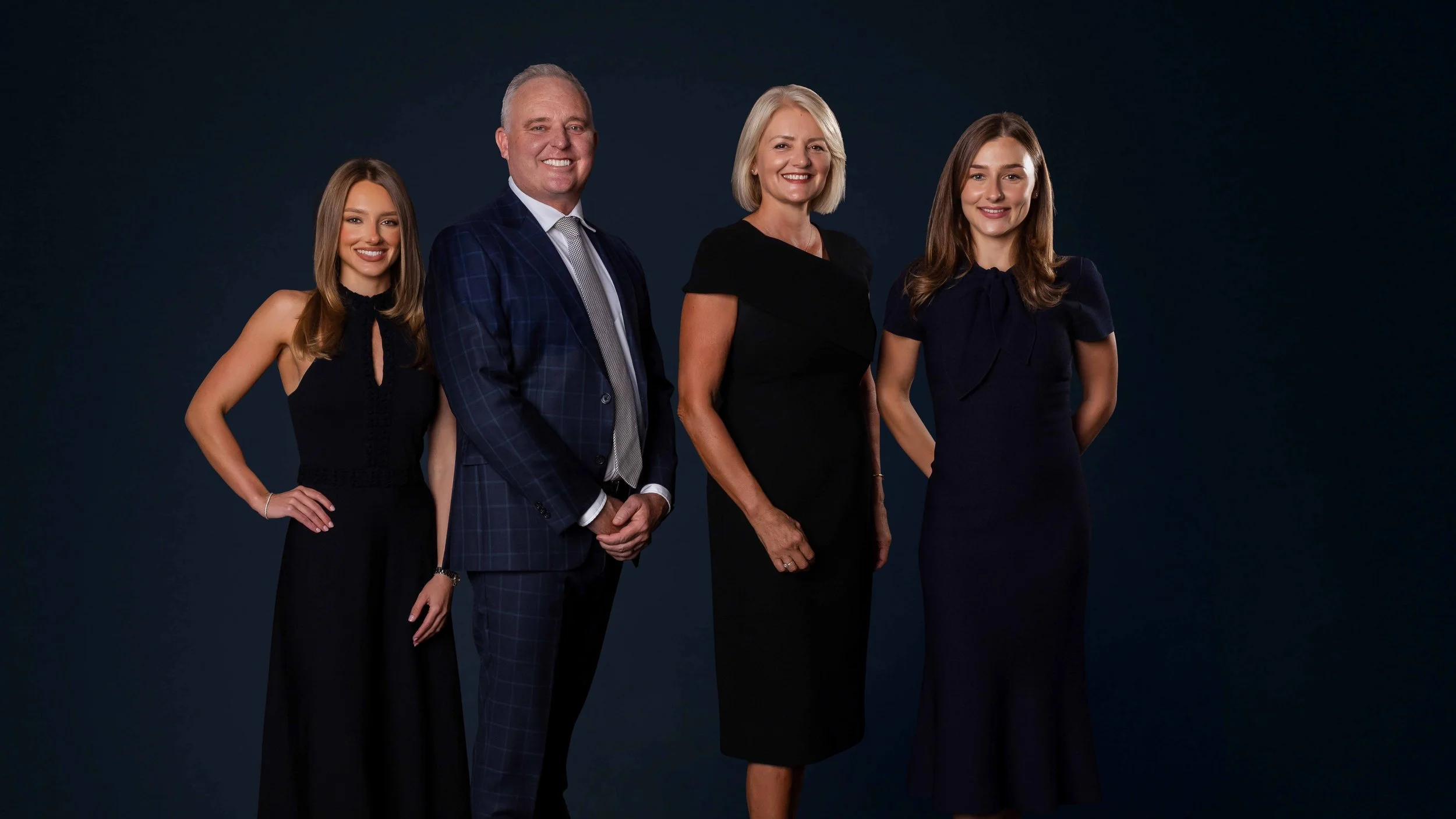 Righton Property team group portrait, dark studio, Brisbane