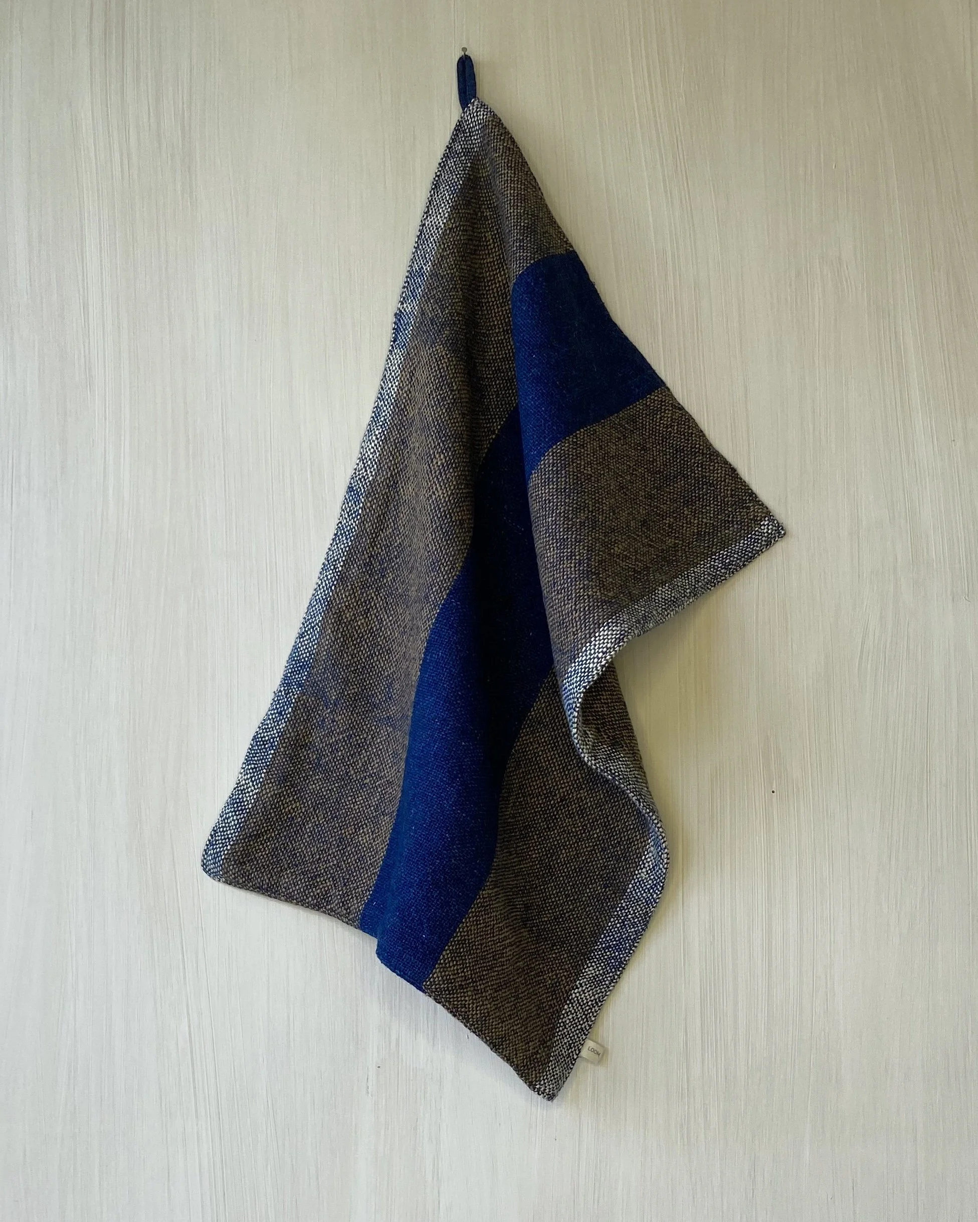 Hand Towel Bold Indigo and Cinnamon Stripe draped from hanging loop Loom Designs.jpg