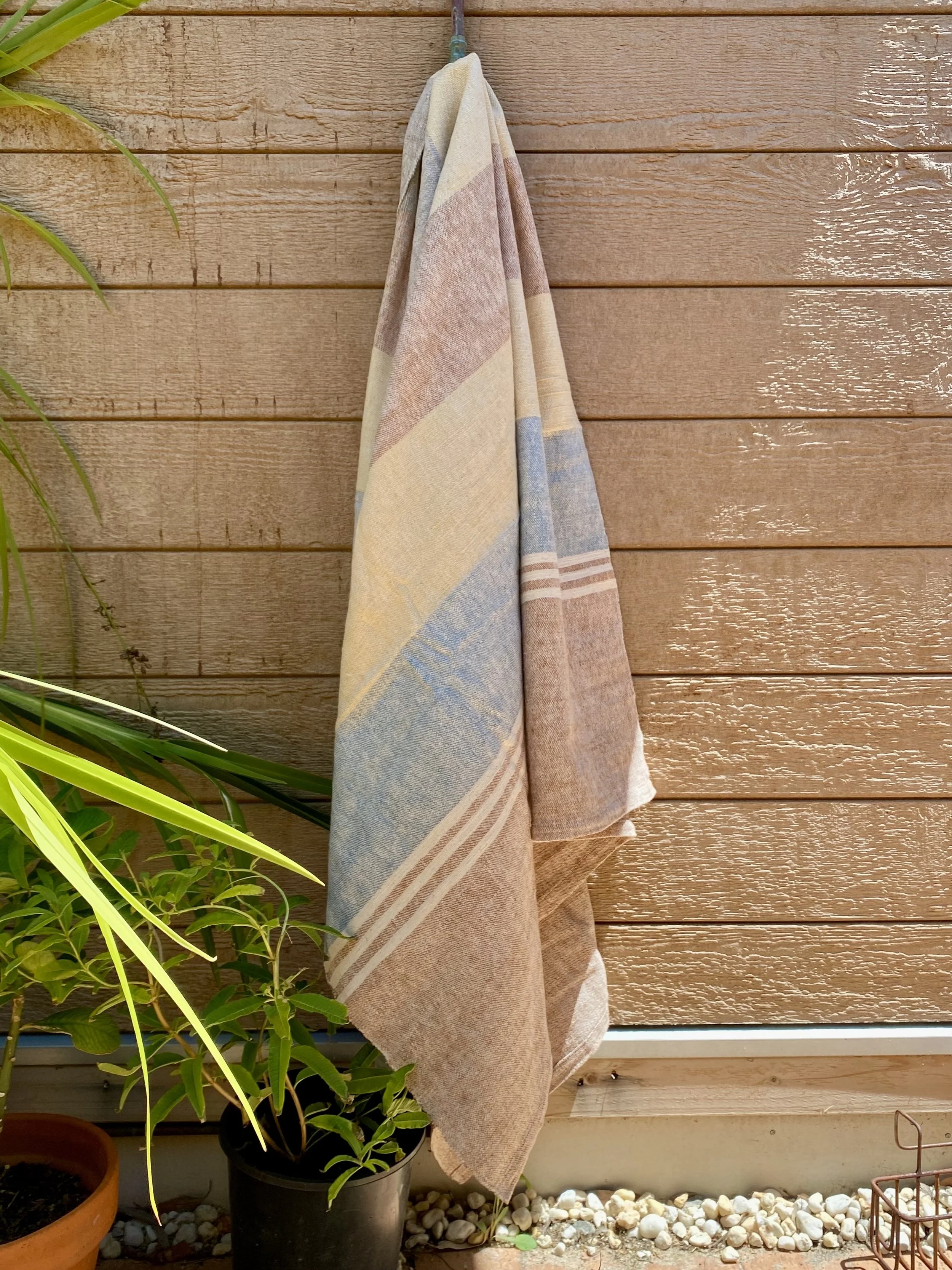 Blue, yellow, brown beach towel.jpg